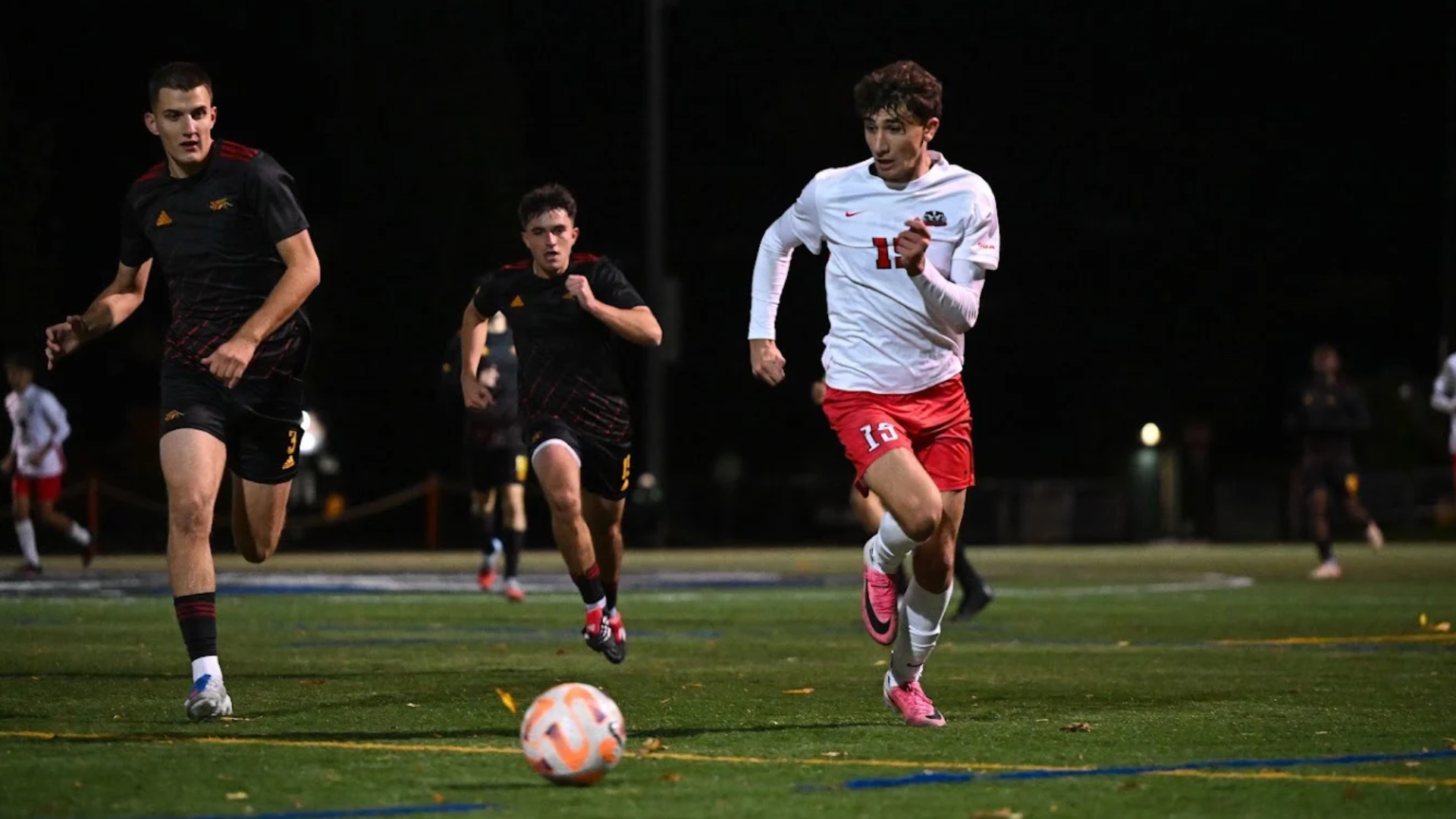 A Brock men's soccer player pursues the ball