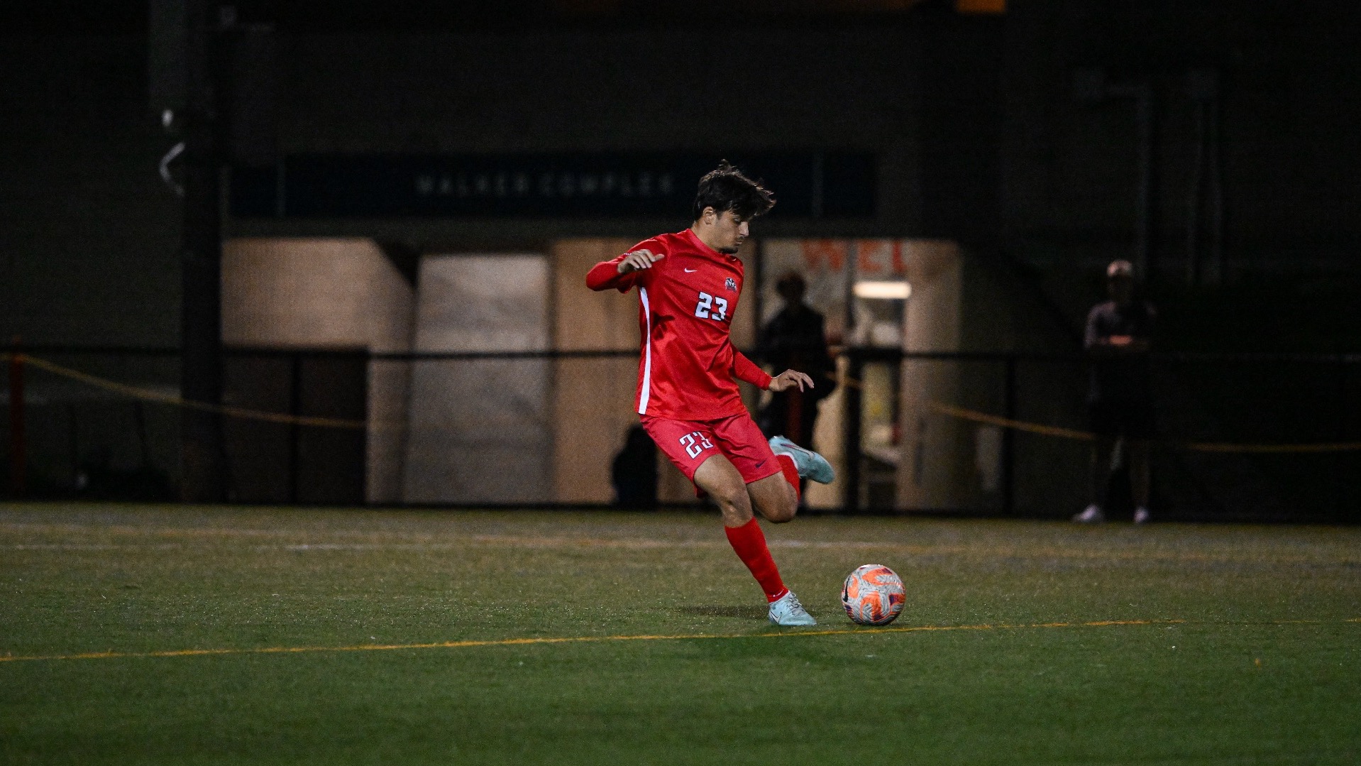 A Brock men's soccer player prepares to kick the ball
