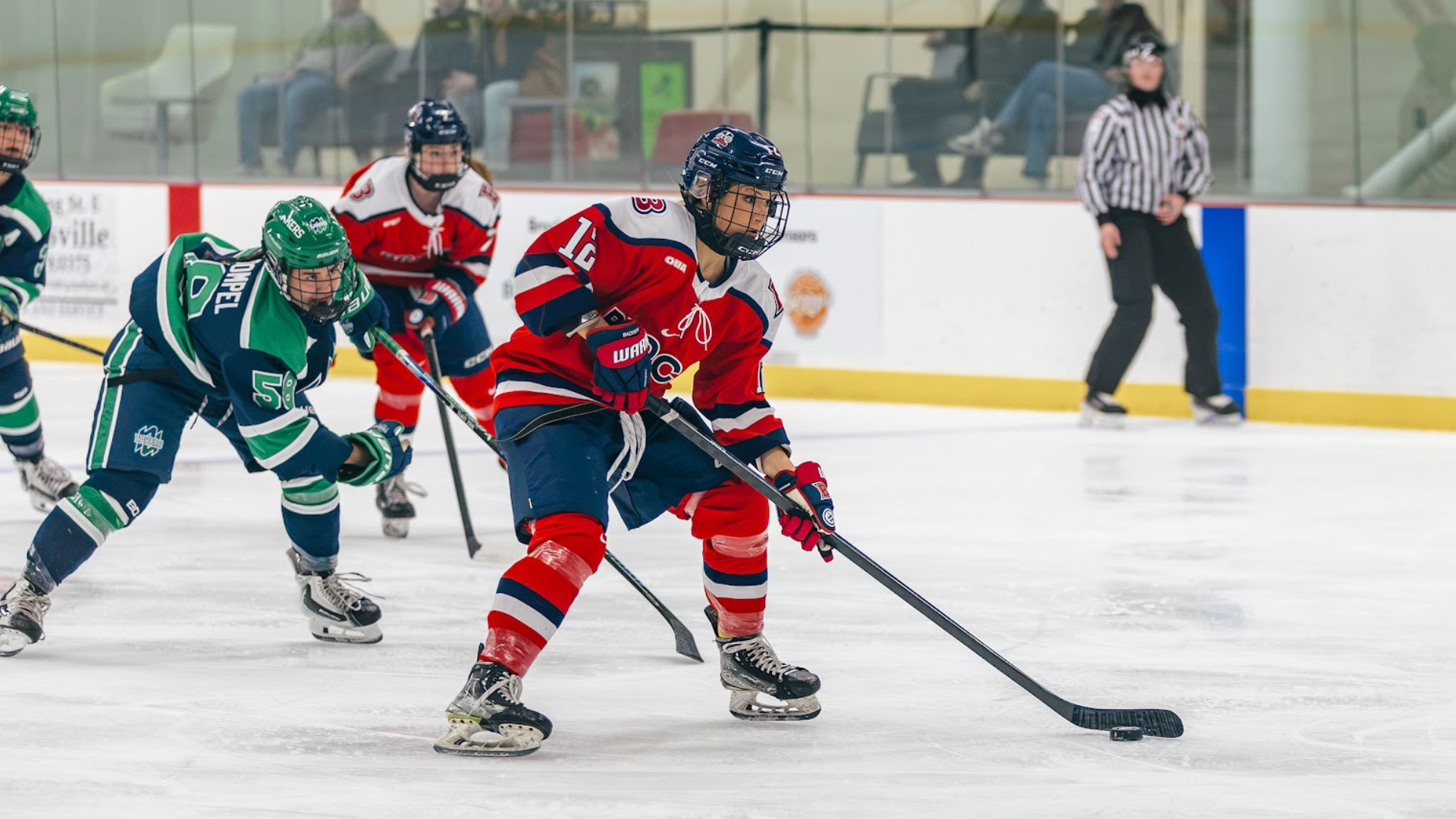 A Brock women's hockey player bears down on the opposition goalie