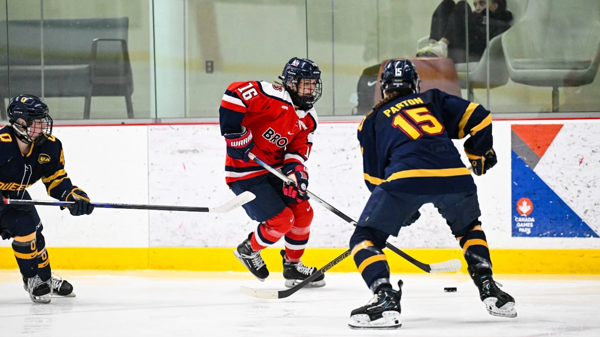A Brock women's hockey player skates with the puck