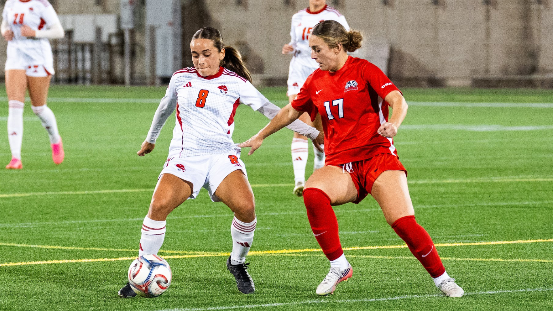 A Brock women's soccer player fights to gain possession from the opponent