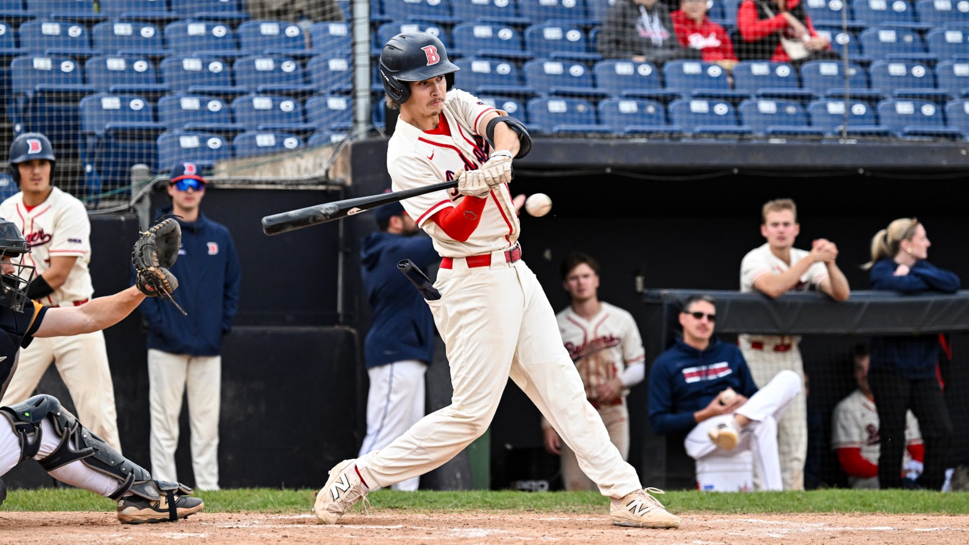 A Brock baseball player swings at a pitch