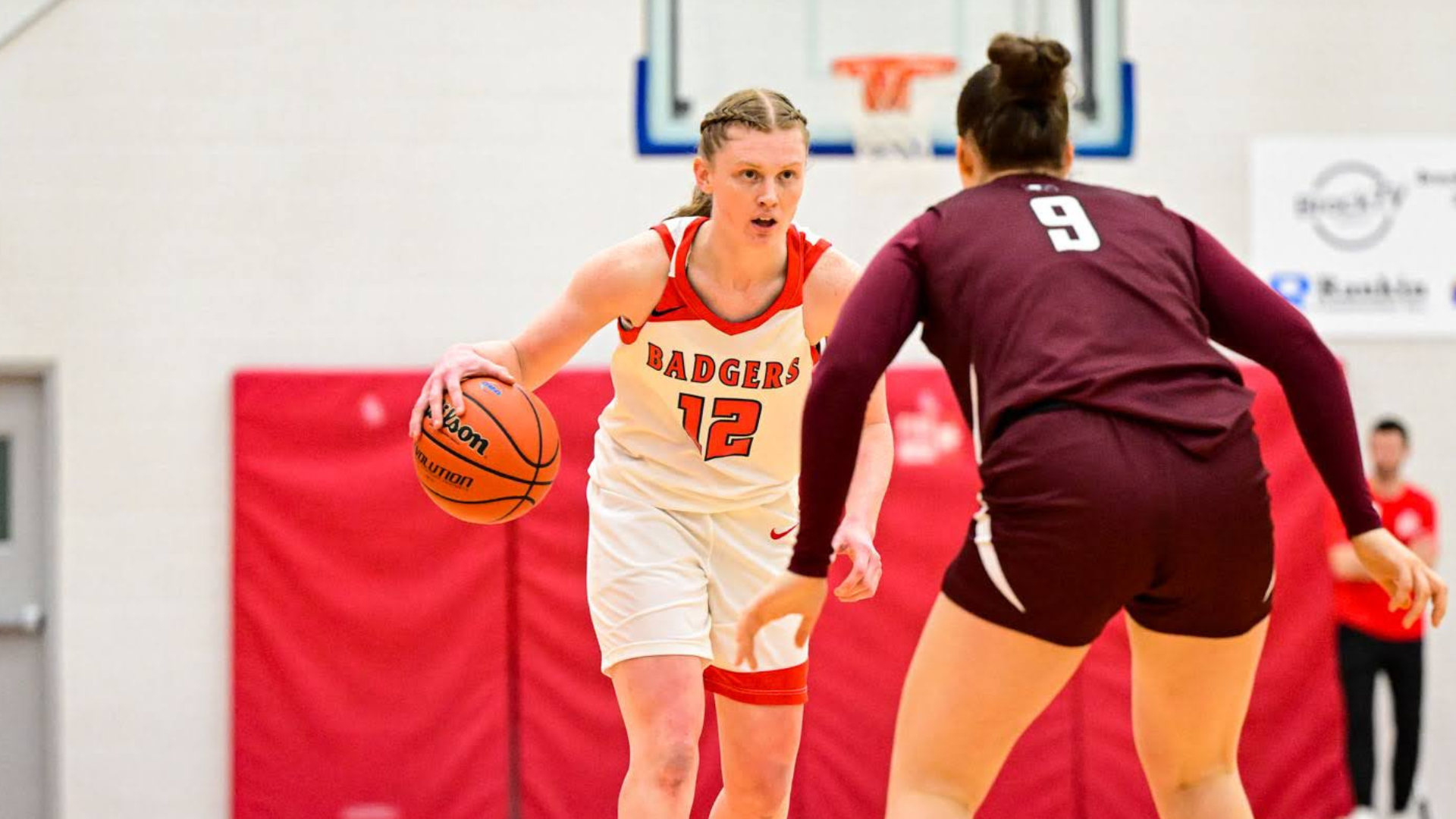 Madalyn Weinert dribbles against the McMaster Marauders