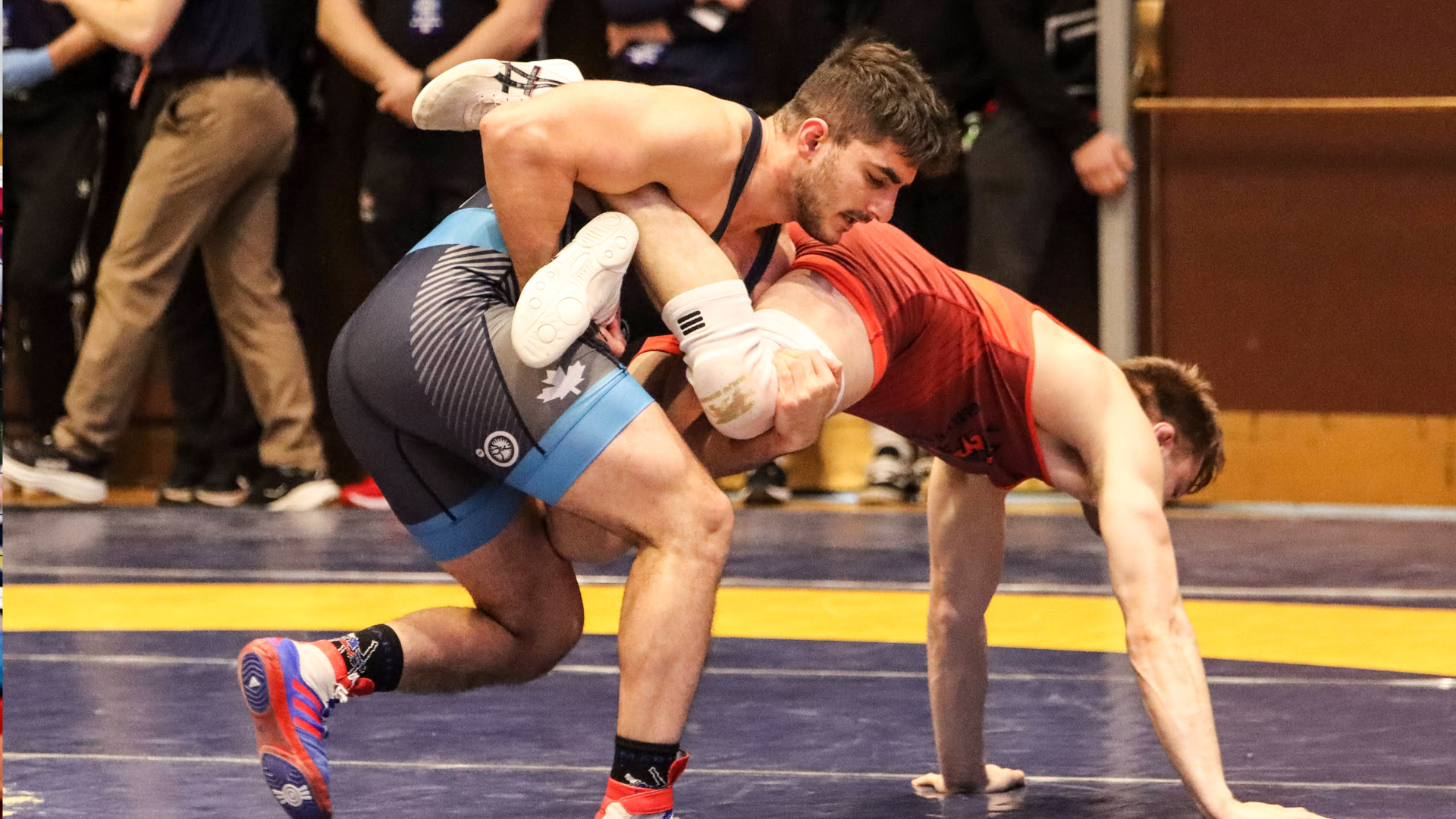 Yazdan Farokhizad grabs the leg of an opponent at the 2026 OUA Championships