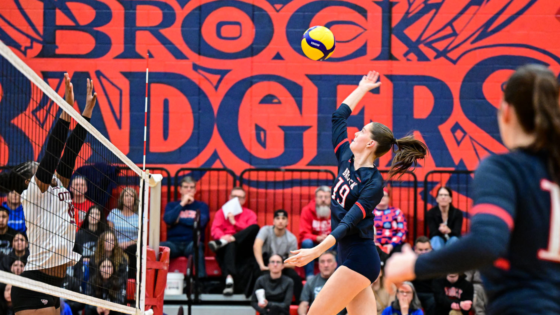 Charlotte Ross hits the ball against the Ottawa Gee-Gees