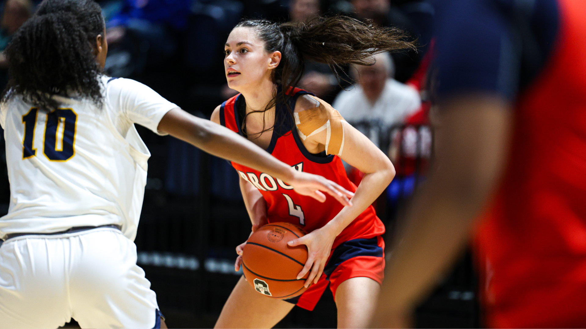 Ava Stranges possesses the ball in an OUA quarterfinal matchup against the Windsor Lancers on Saturday, Feb. 21 at Toldo Lancer Centre. (Photo by Alex Binaei) 