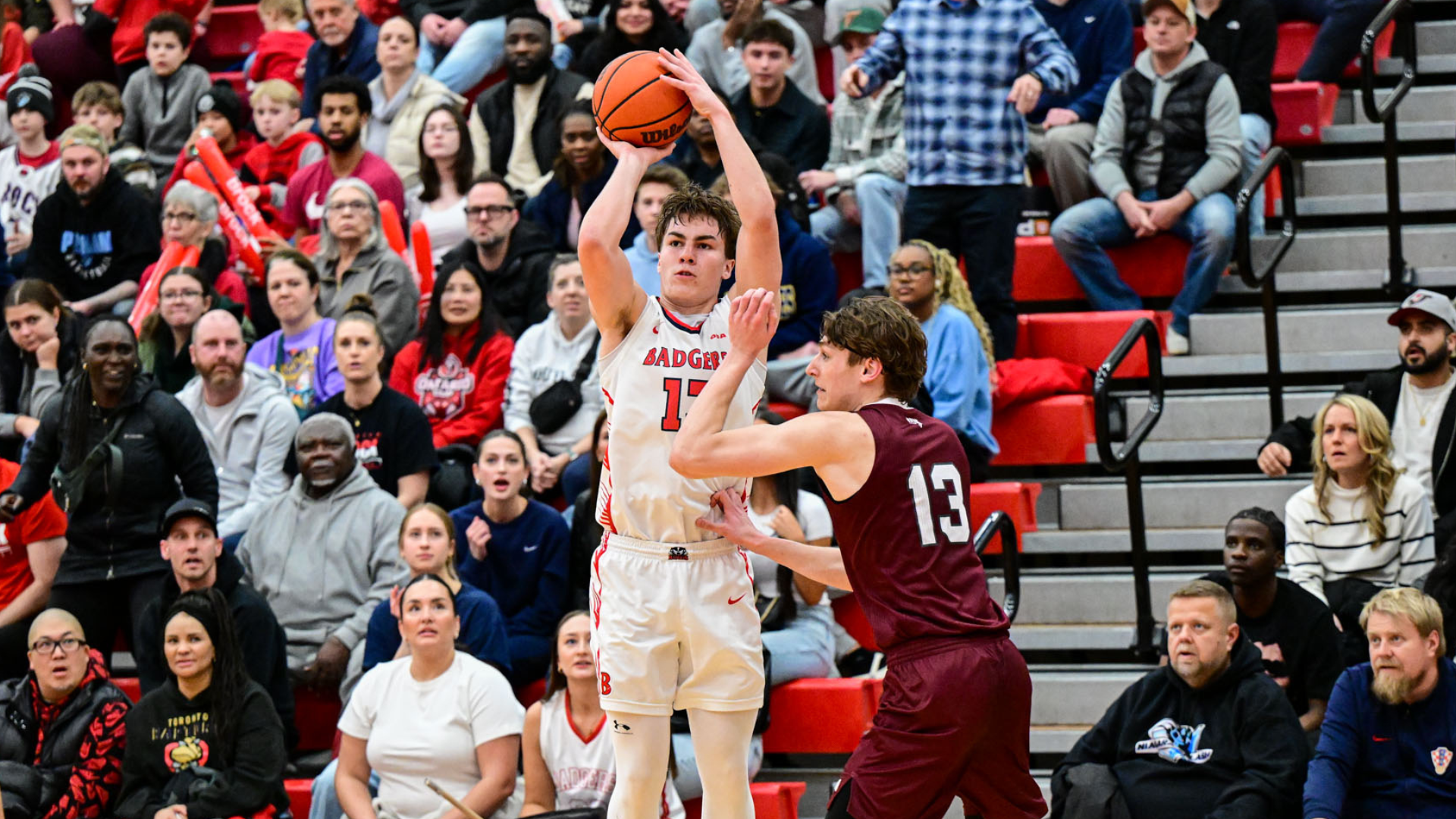 Birch Pockar, a Brock Badgers men's basketball player, takes a three-point shot against the Ottawa Gee-Gees in the OUA Quarterfinals