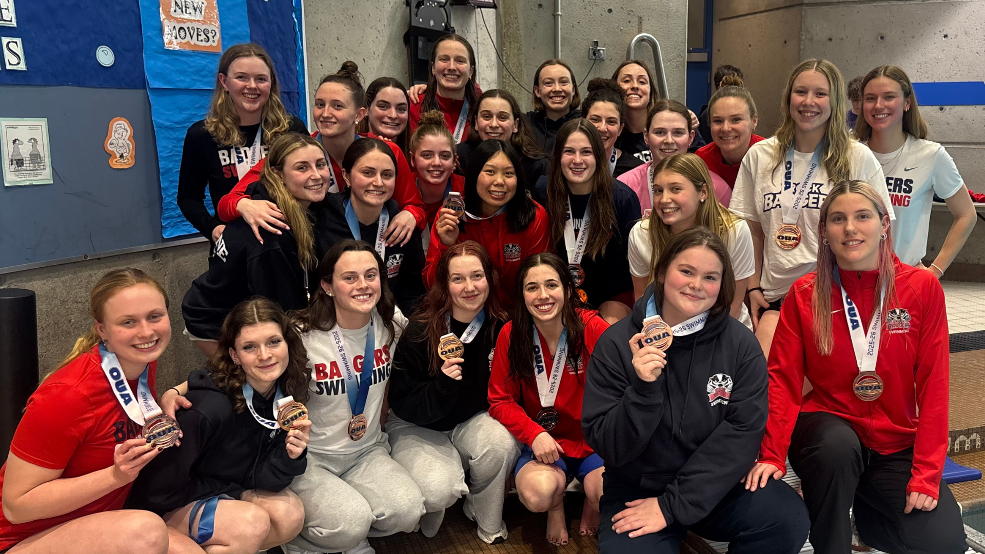 Brock women's swimming team celebrates with their bronze medals