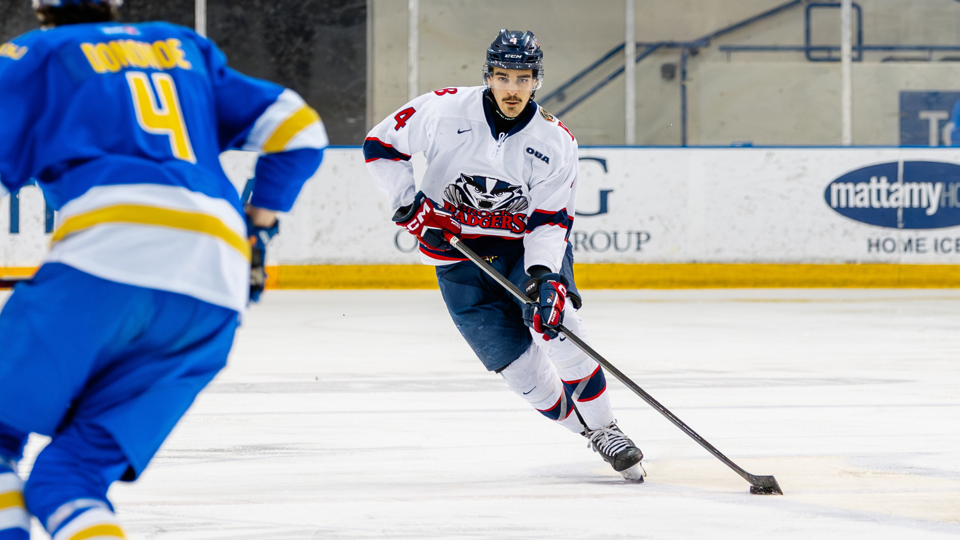 Jonah Boria carries the puck against the TMU Bold