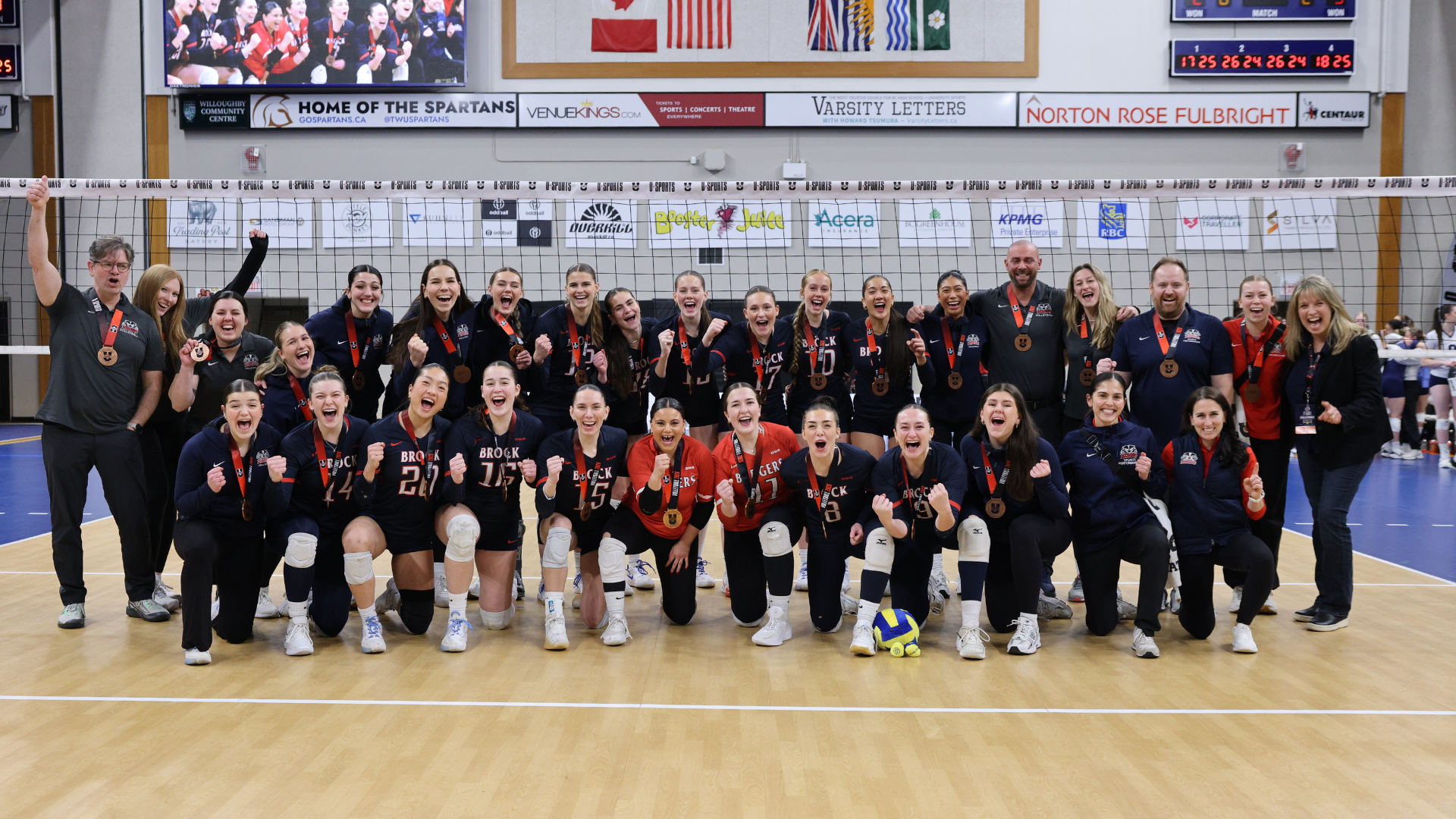 The Brock Badgers women's volleyball team celebrates its bronze-medal victory at the 2026 U SPORTS Championship at the Langley Events Centre in Langley, B.C., on Sunday, March 15.