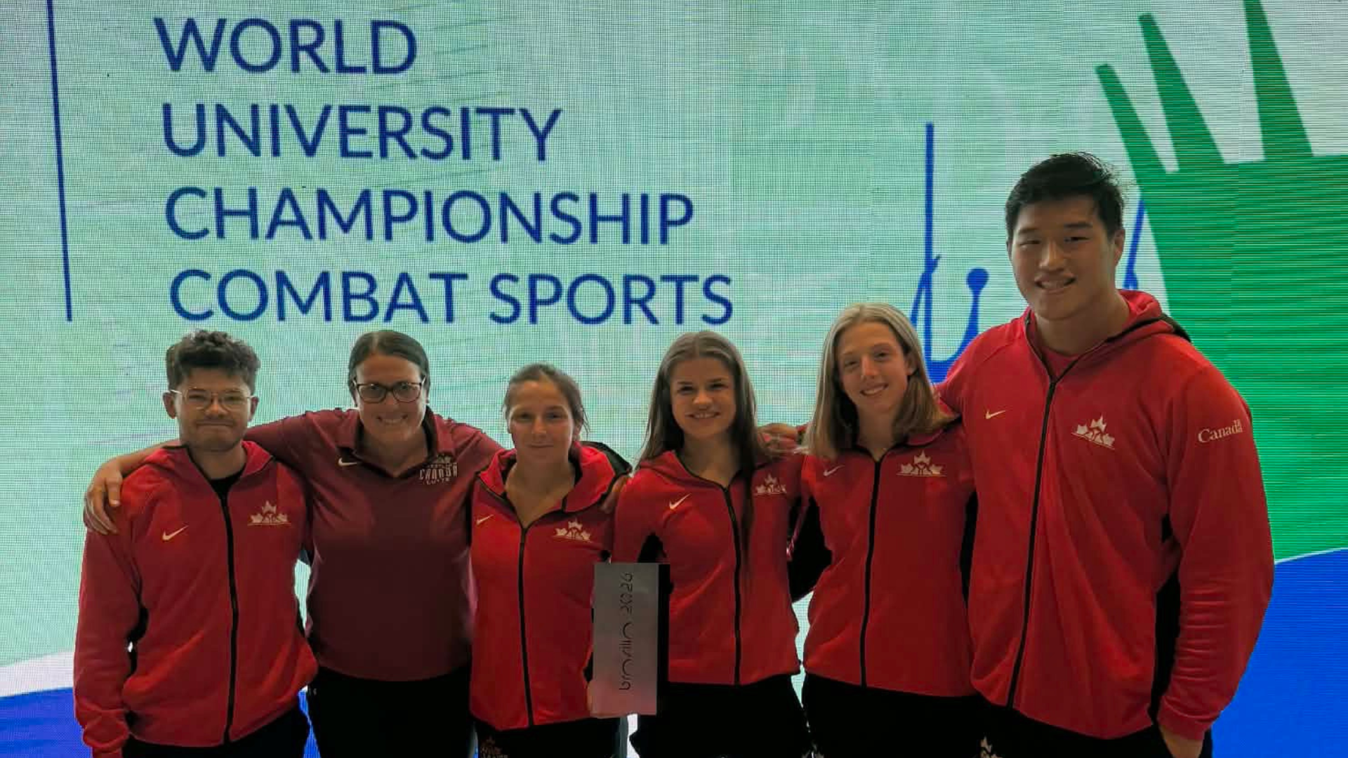 Brock wrestlers and Heather Sweezey pictured at FISU 