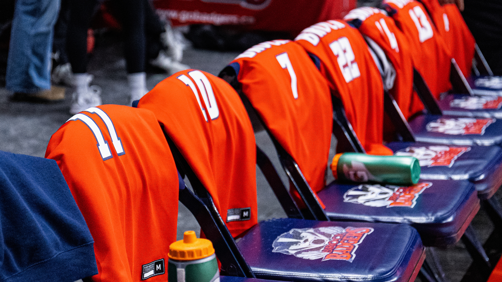 Women's basketball jerseys on chairs