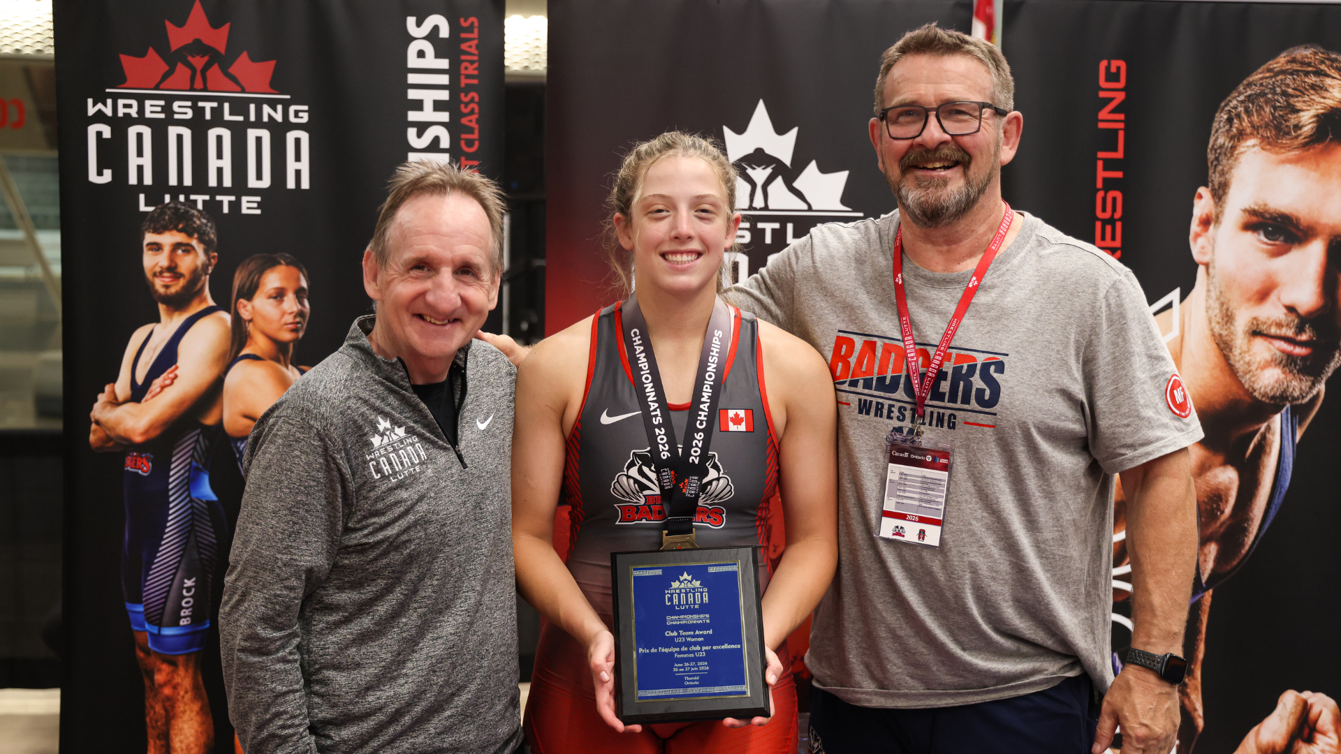 Cassie Corbett poses with team award