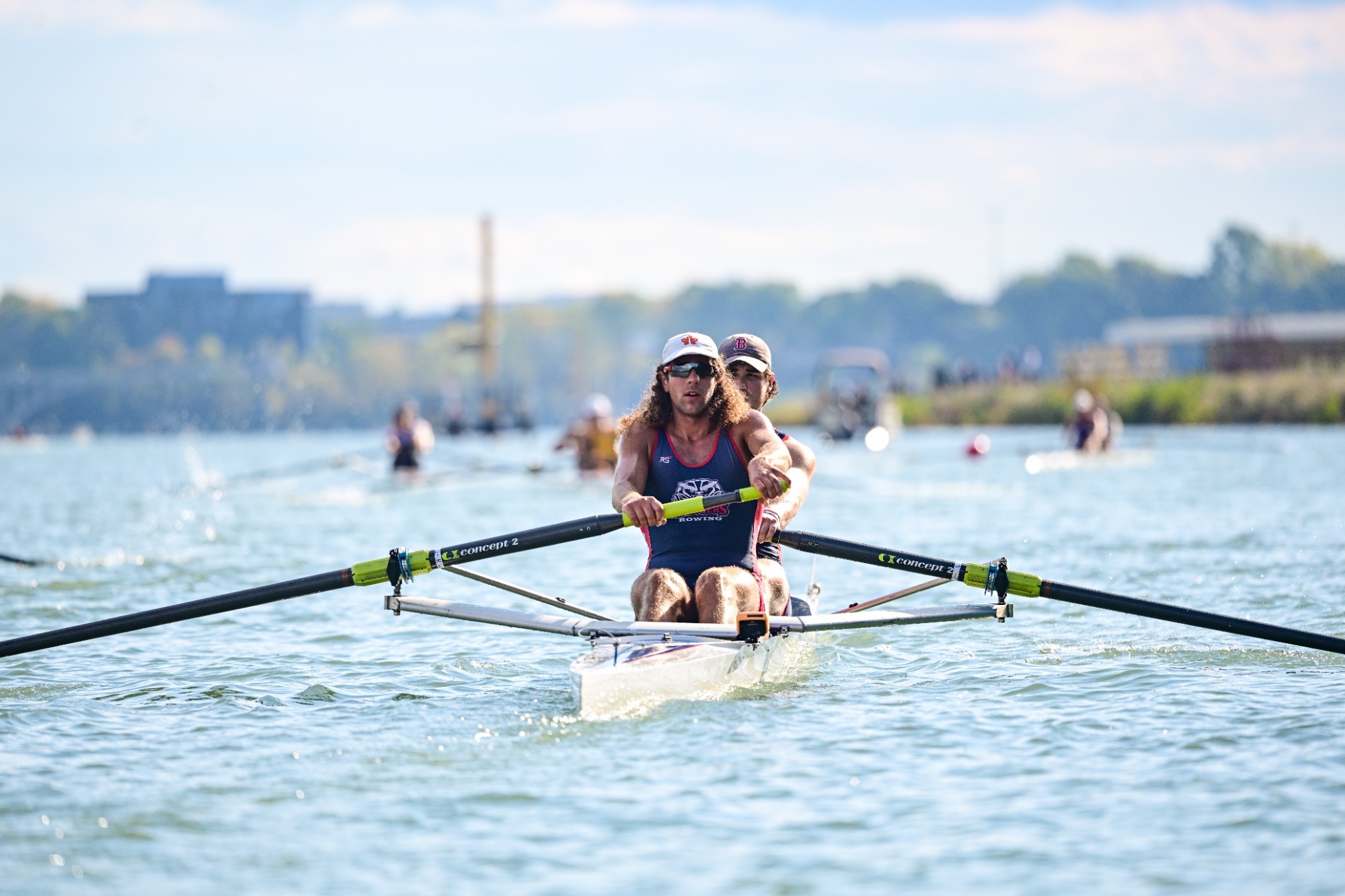 A Brock men's rower rows forward