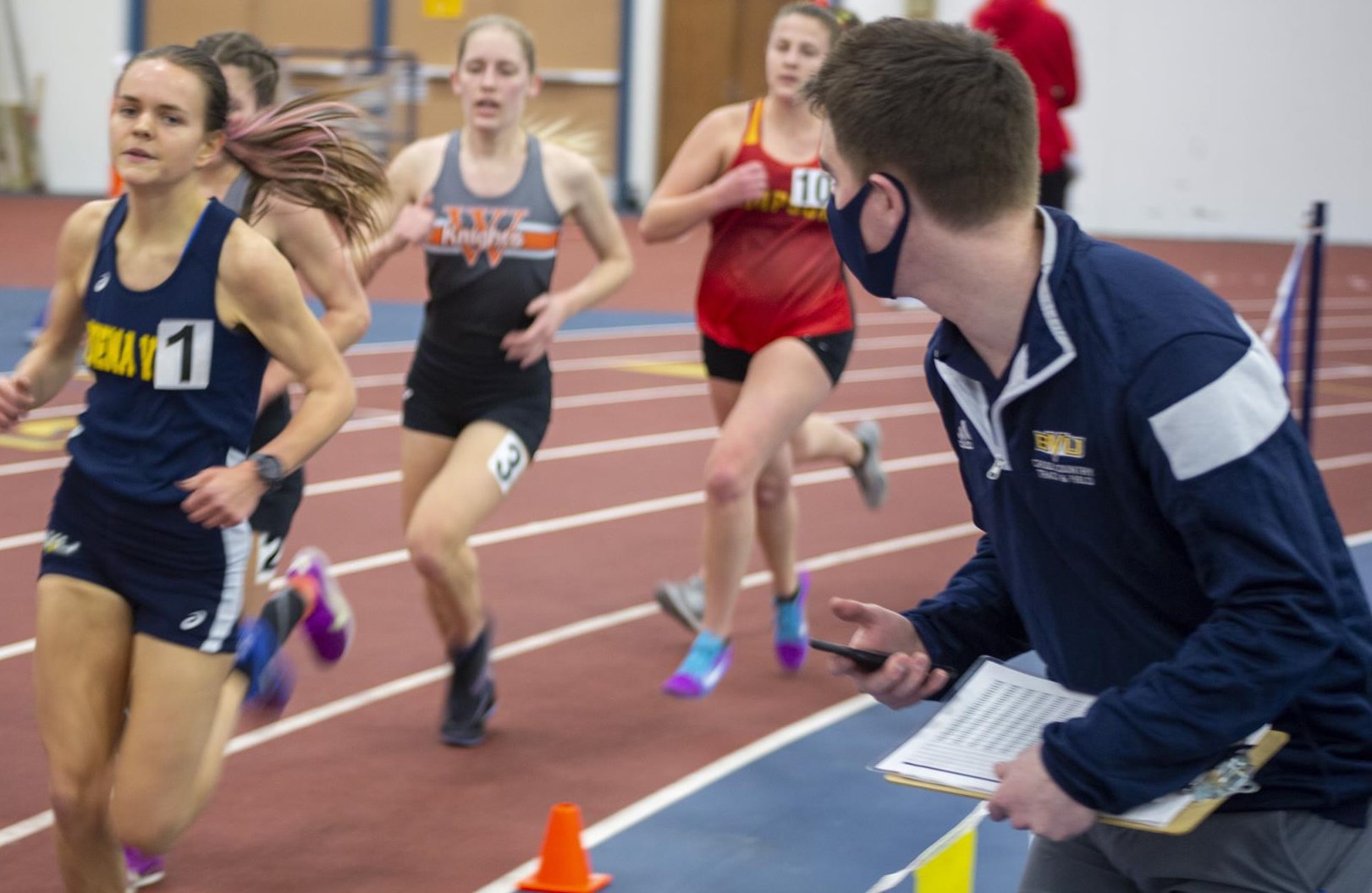 Chris Orlow cheering on Emily Hoesing during indoor season