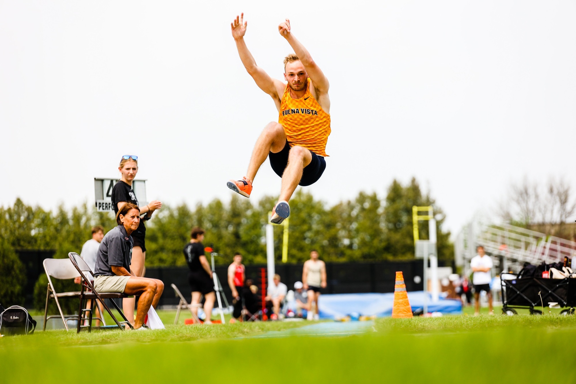 Zack Huffman competes in the long jump at the conference outdoor championship
