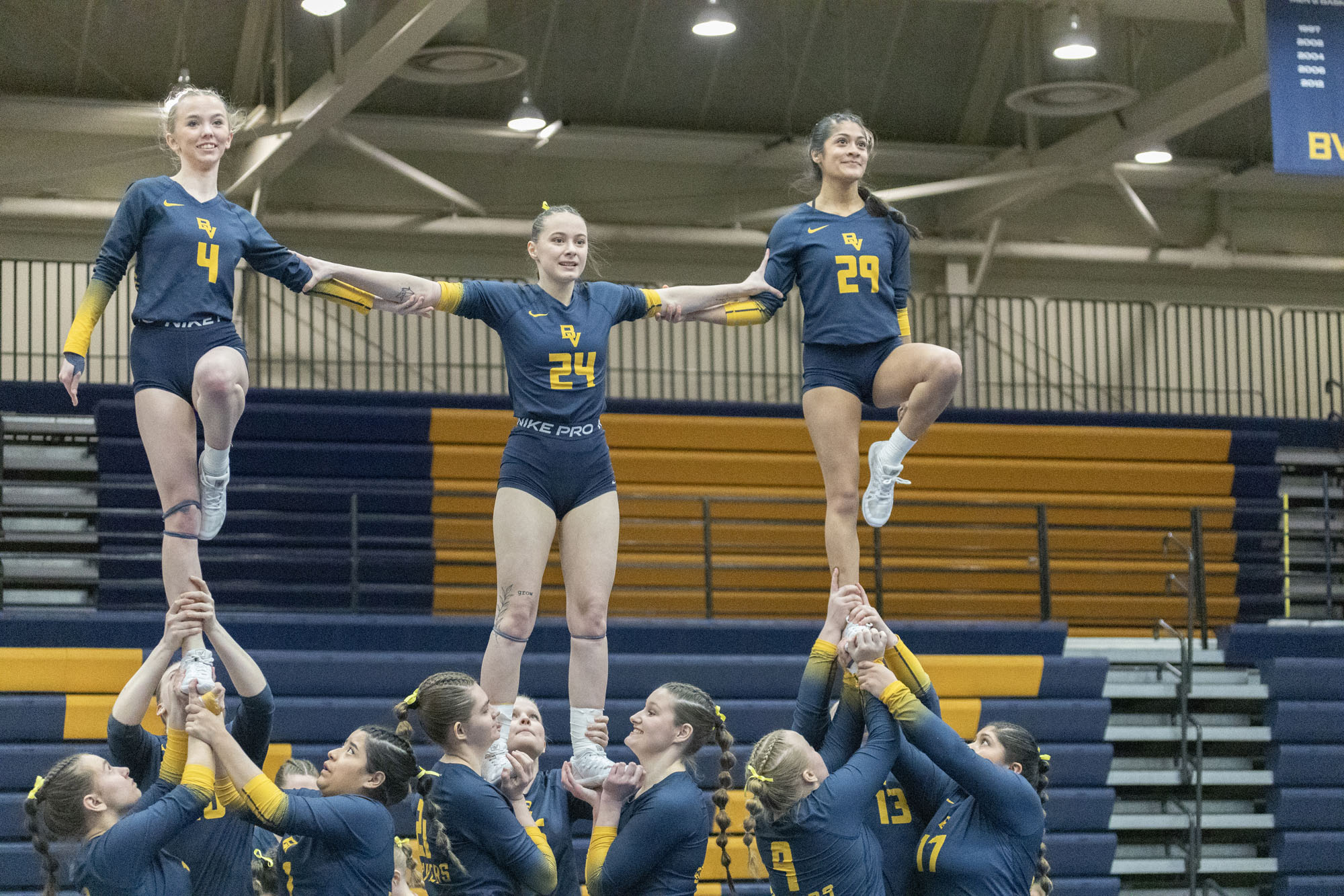 Keyanna Rote, Cassidy Weide, and Dayanna Bueso; BVU STUNT vs. Saint Mary's