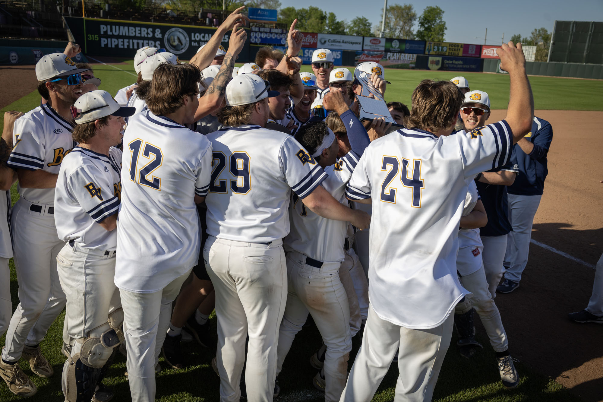 Beavers celebrate an American Rivers Conference Tournament championship in Cedar Rapids