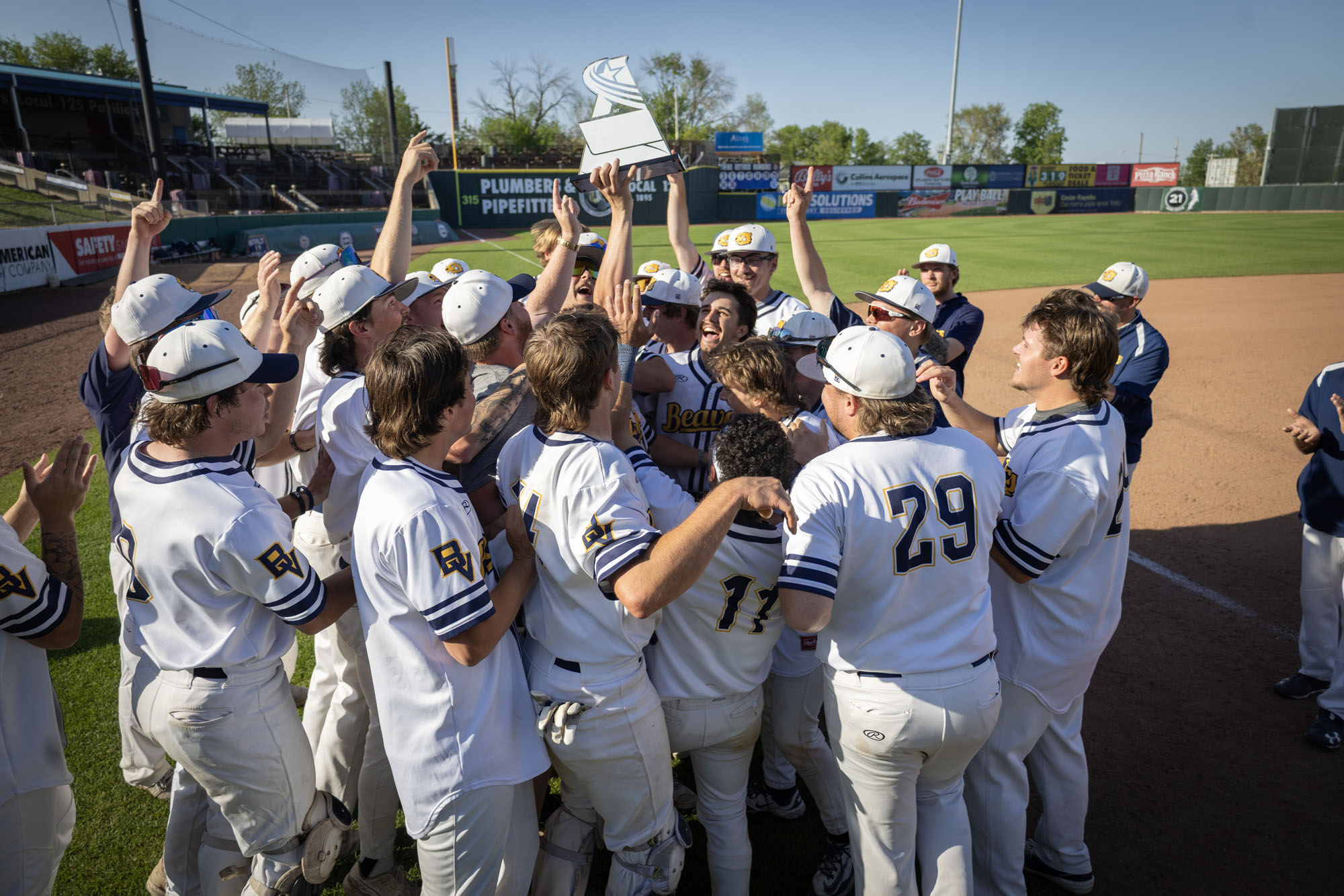 Beavers celebrate an American Rivers Conference Tournament championship in Cedar Rapids