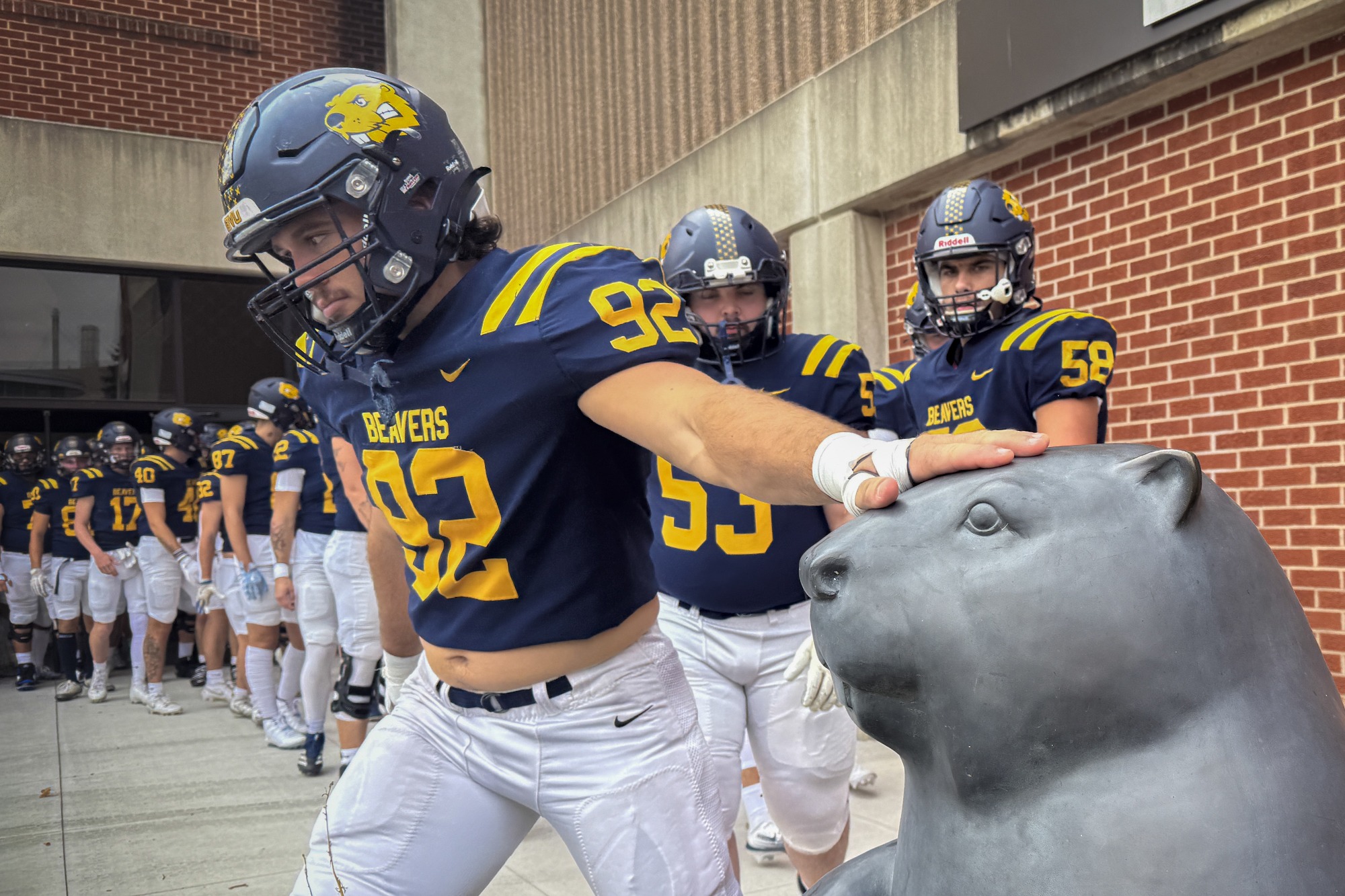 Ryan Hosek touches the Beaver statue before taking the field