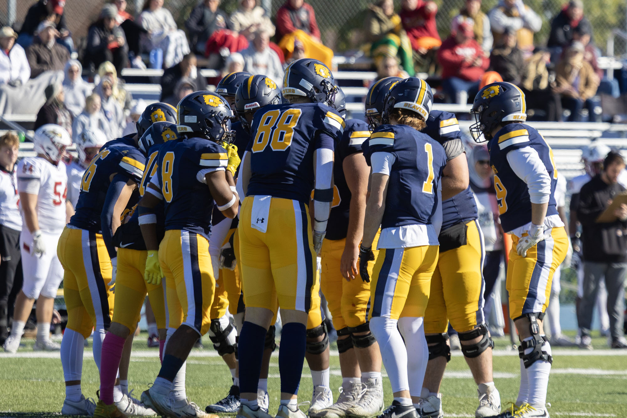 Team huddle, BVU football vs. Coe