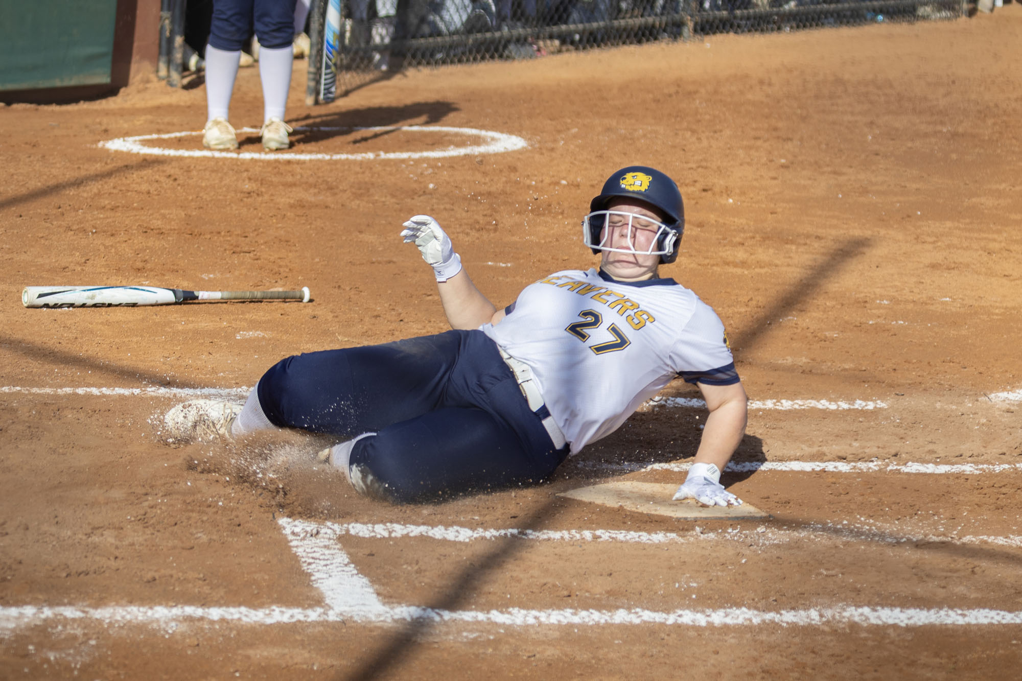 Karlee Noe slides into home, BVU softball vs. Regis College