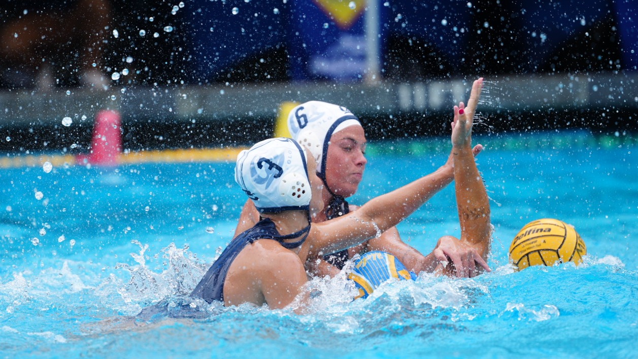 Feline Voodouw and Julia Bonaguidi defend against UCLA at Spieker Aquatics Complex