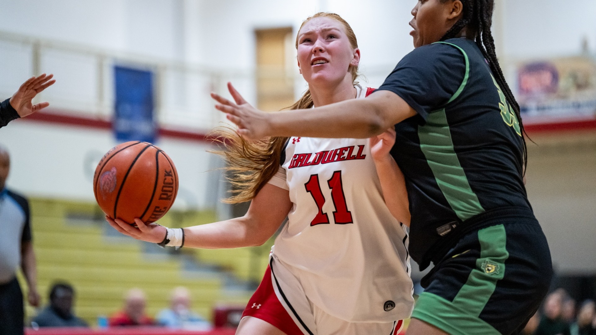 Coogan wards off defender