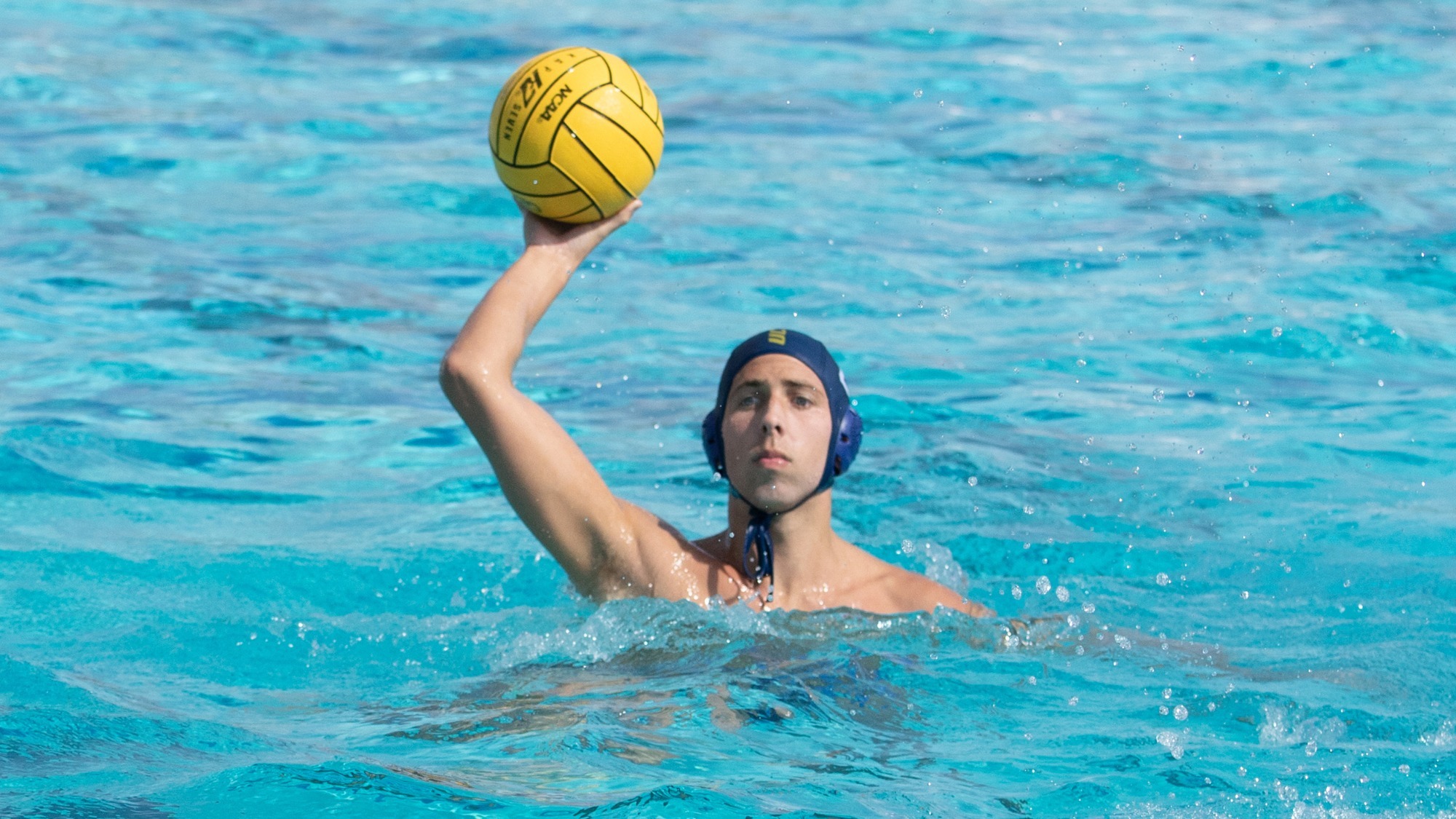 Finn Moss passing the ball vs. CUI at the UC Merced Aquatics Center on October 9, 2026