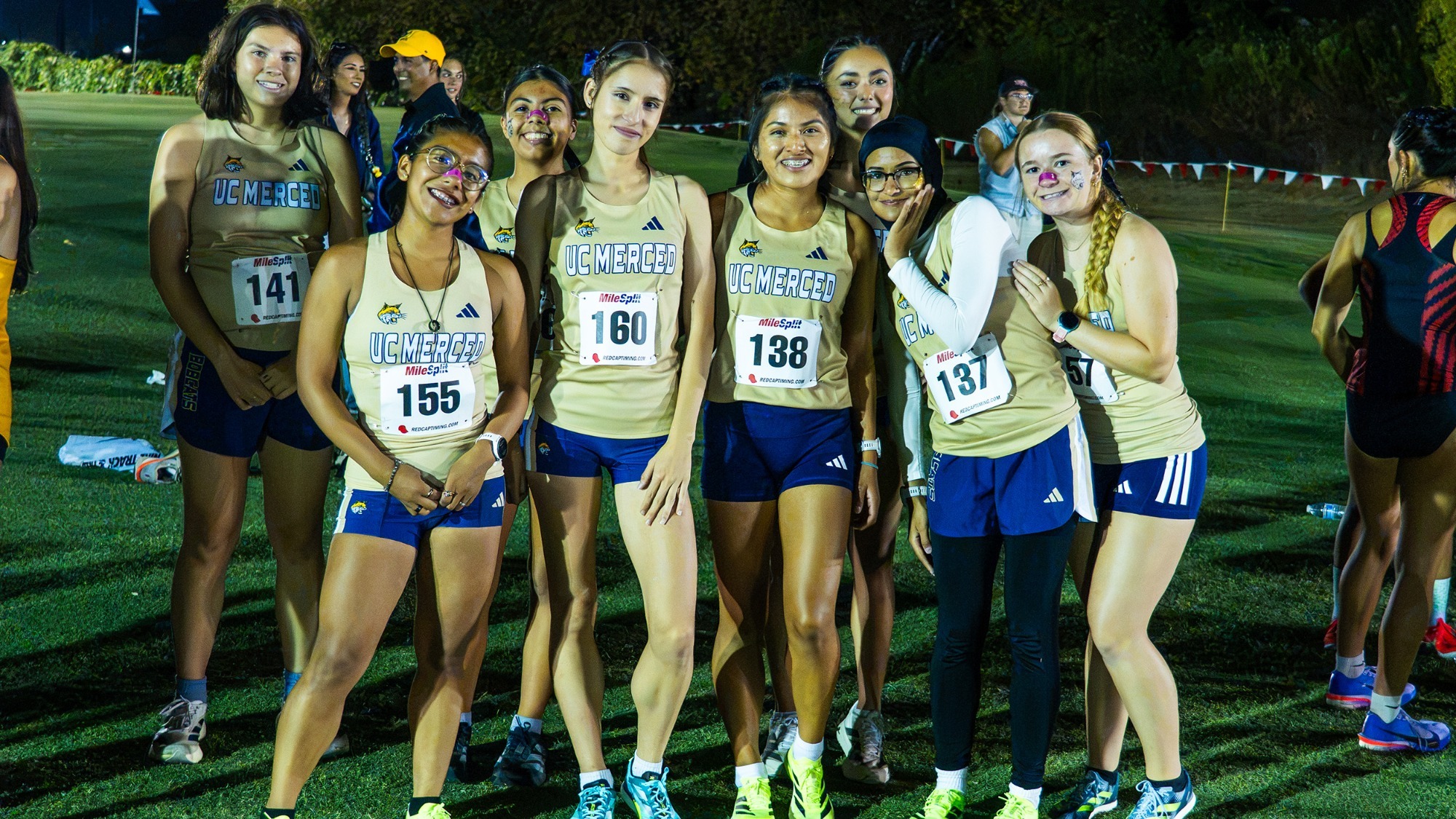 UC Merced women's cross country runners pictured at the starting line of the Kim Duyst Twilight