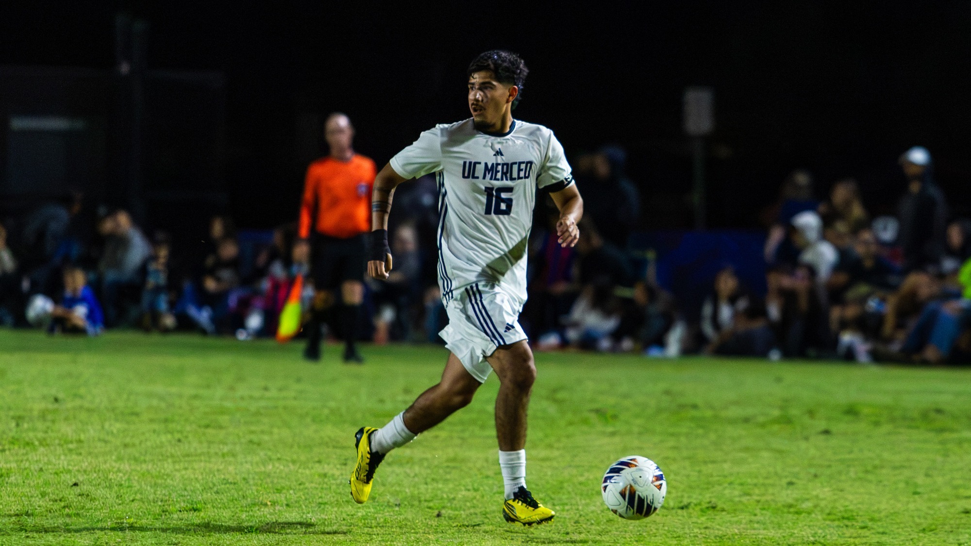UC Merced's Omar Garcia dribbling down the field against Cal Poly Pomona on September 25, 2026