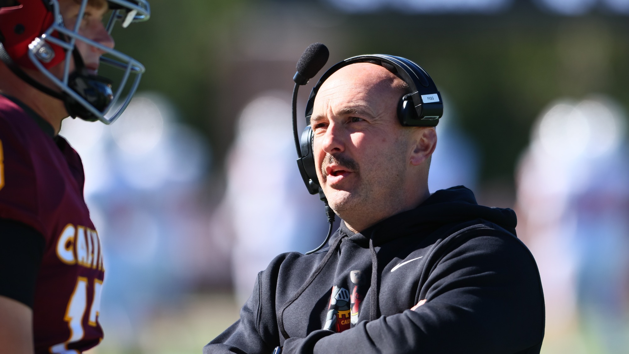 Calvin Head Football Coach Trent Figg Instructs Thomas Vaccaro vs Kalamazoo - 10-17-26