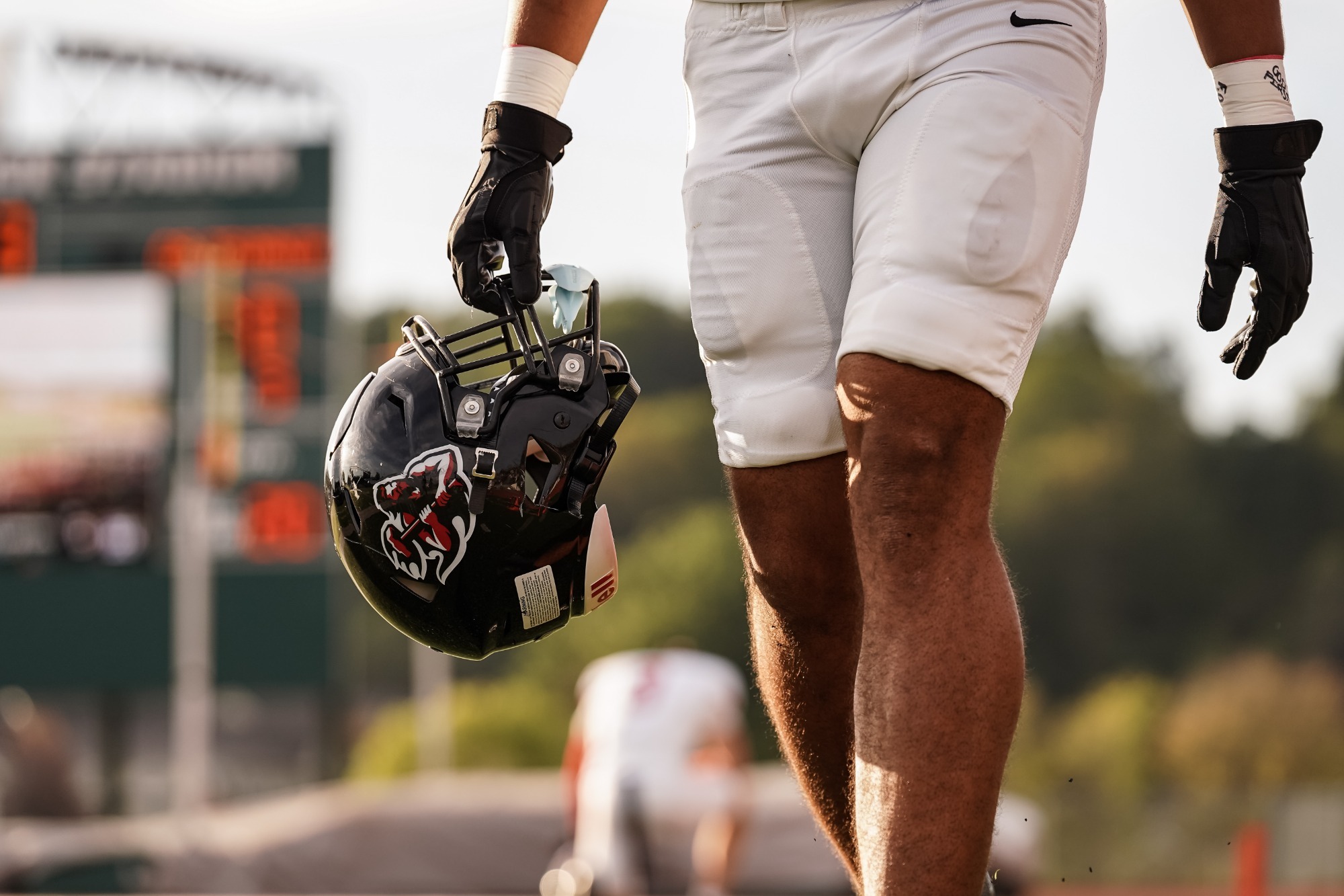 player holding helmet