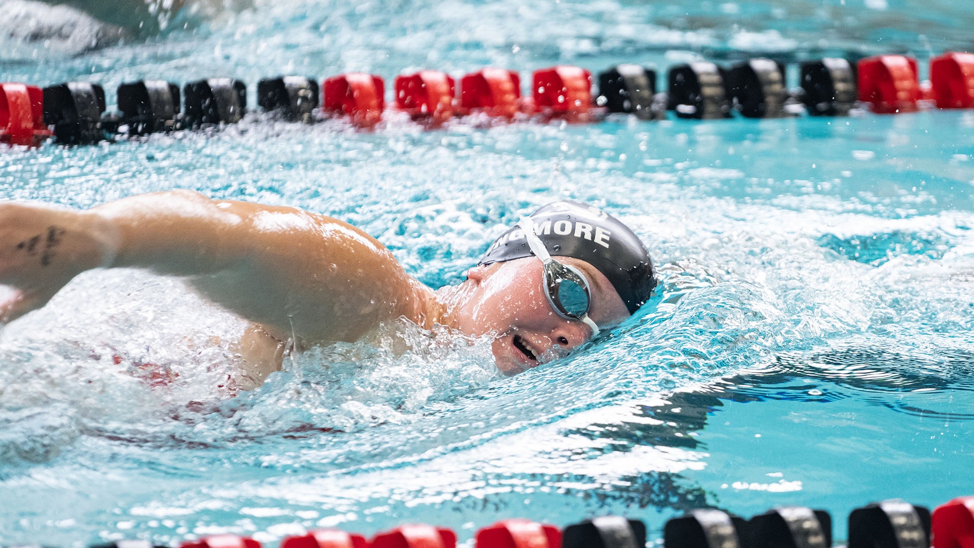 California swimmer Isabella Longmore competing in a freestyle swimming event.