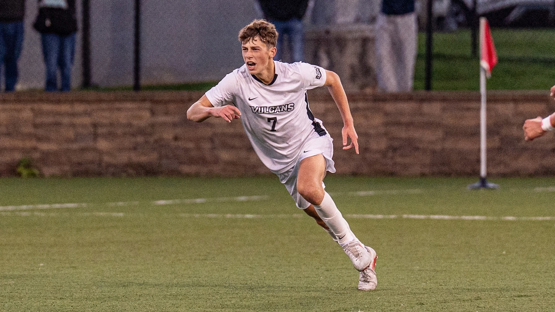 California men's soccer player Ryan Moessner (No. 7) celebrates after scoring a goal during a match.