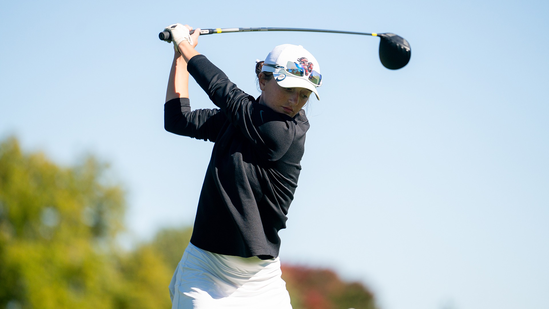 Payten Leet executing a top-of-backswing drive on the tee during a golf tournament.