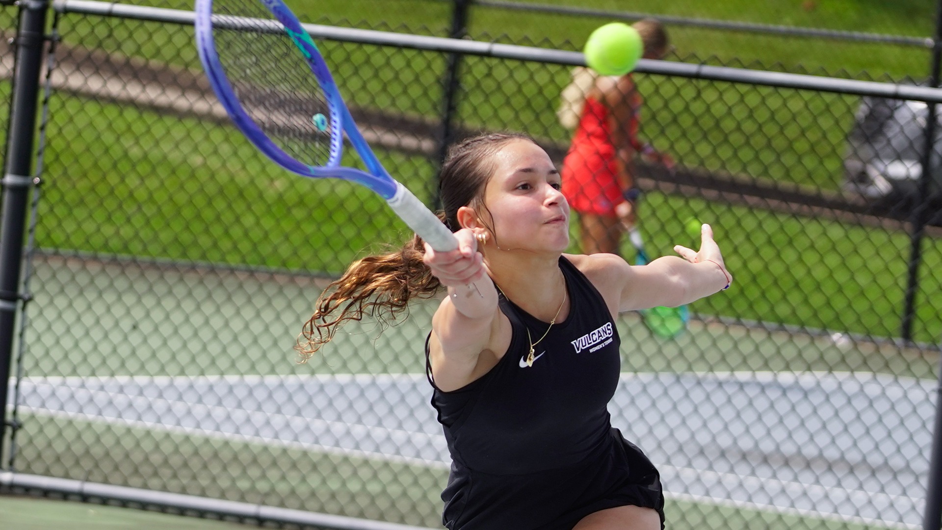Freshman Marion Sendra Lara extends to reach a forehand return during a tennis match against Shippensburg.
