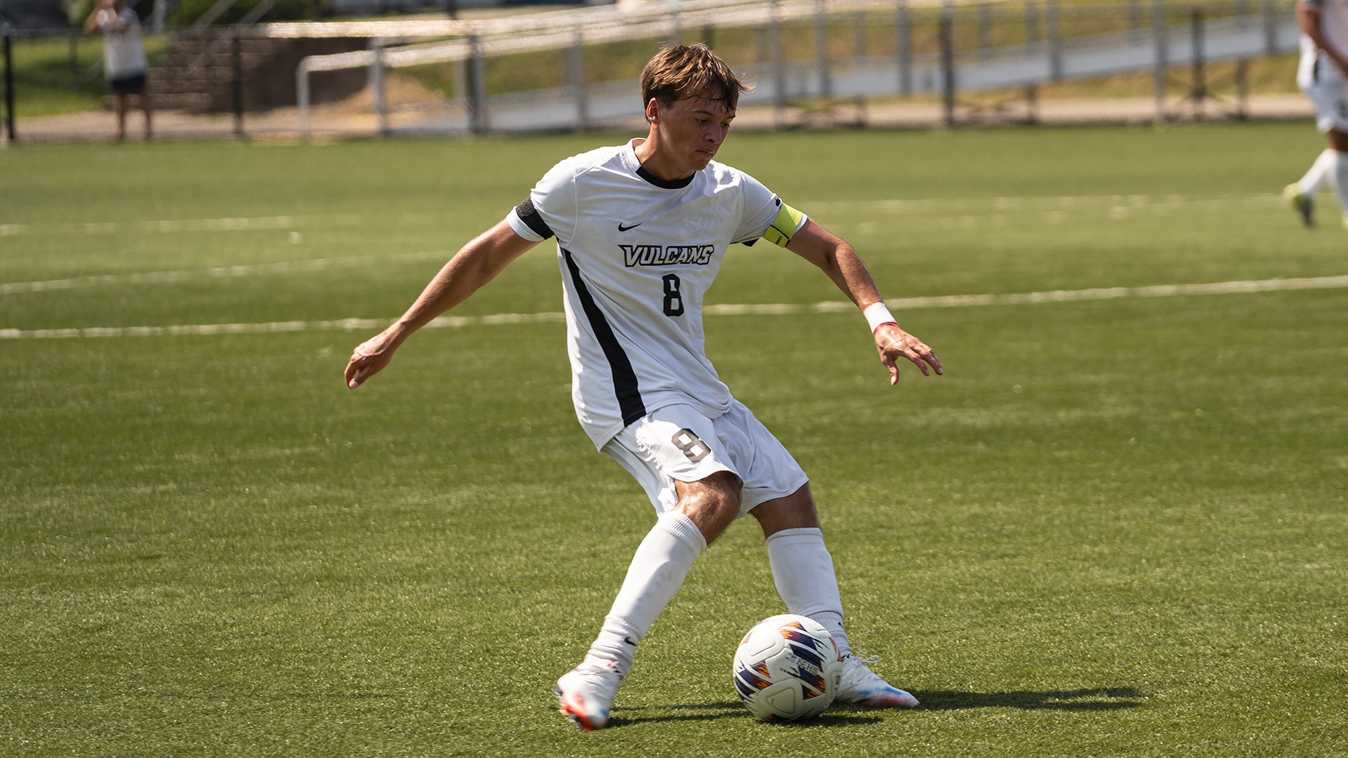 Soccer player Jacob Gretz, wearing a white uniform with the word 