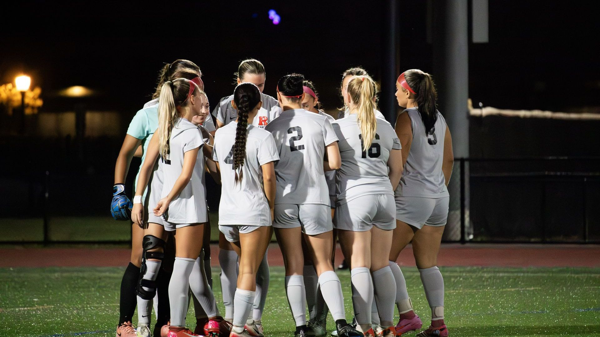 Women's soccer team huddle