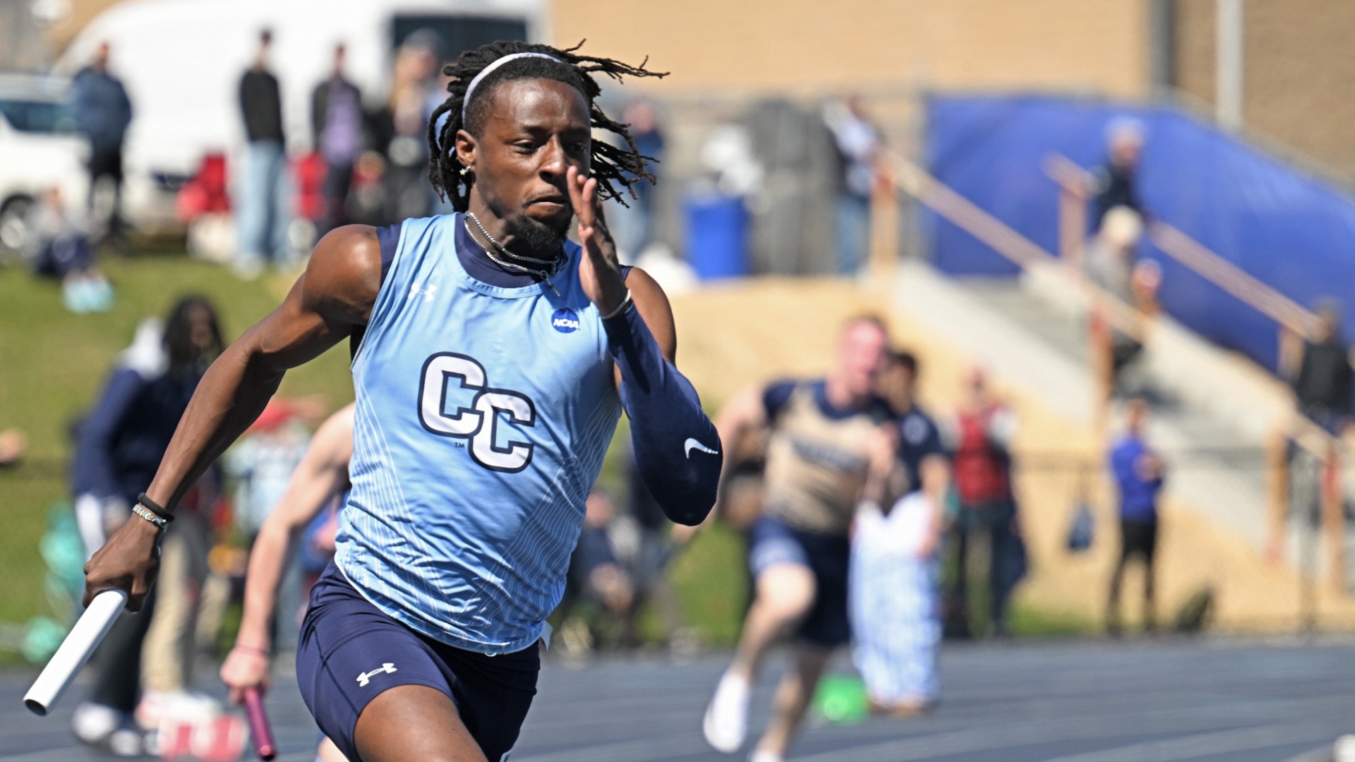 Colin Blades-Thomas running a relay at the 2026 Silfen Invitational