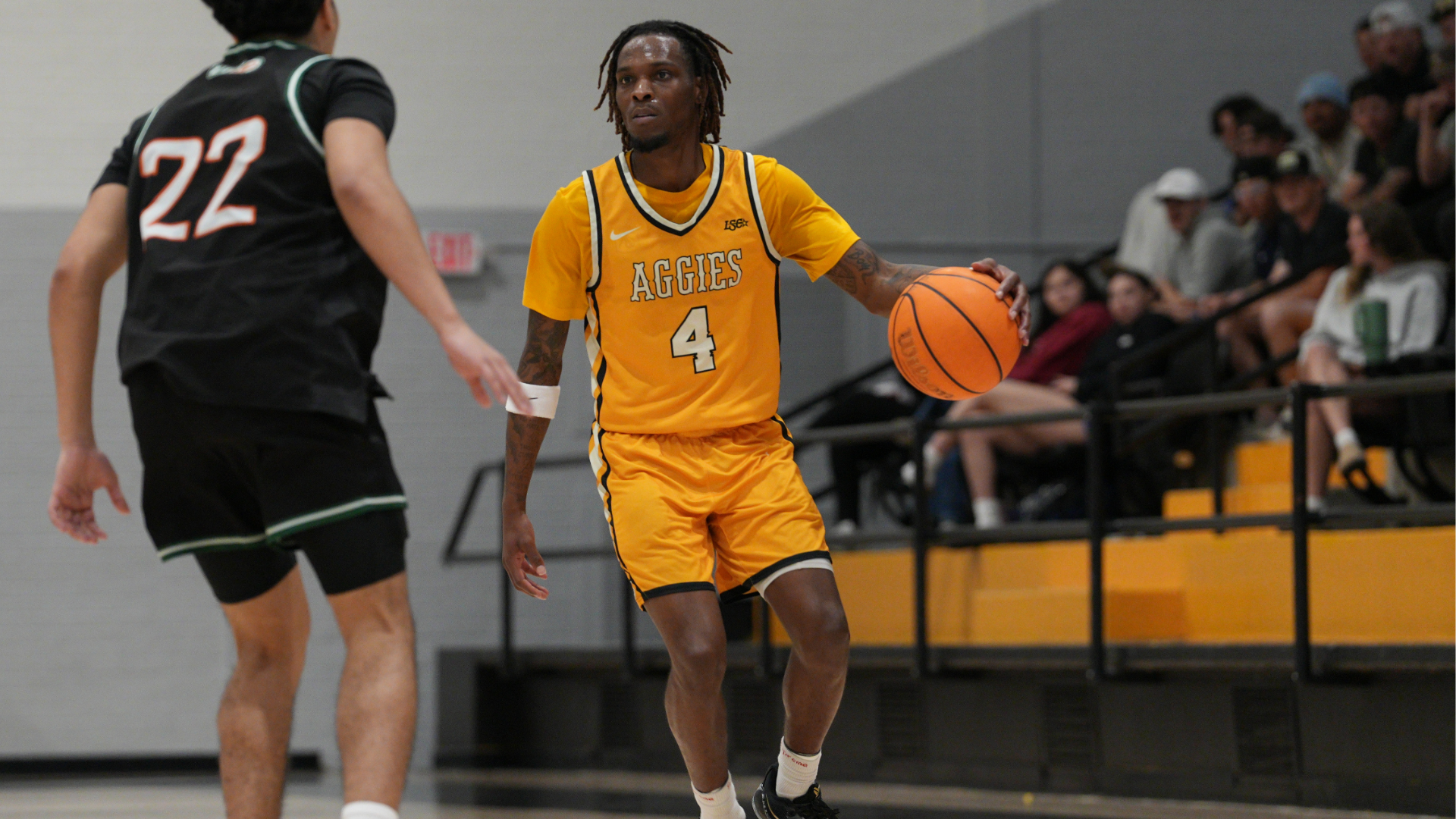 Cameron Men's basketball player dribbling the basketball