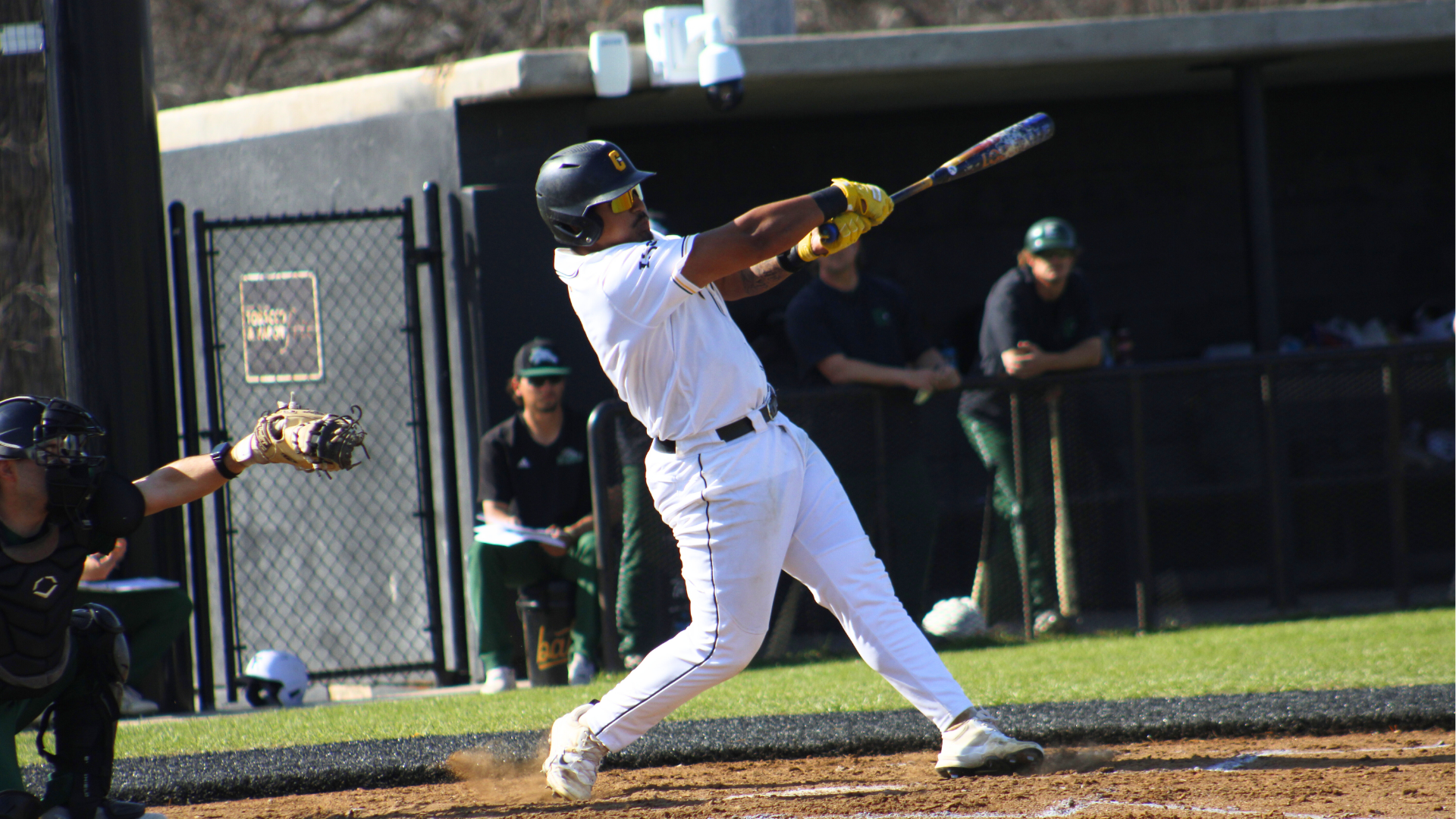 Baseball player Daniel Yardley swings bat against Eastern New Mexico