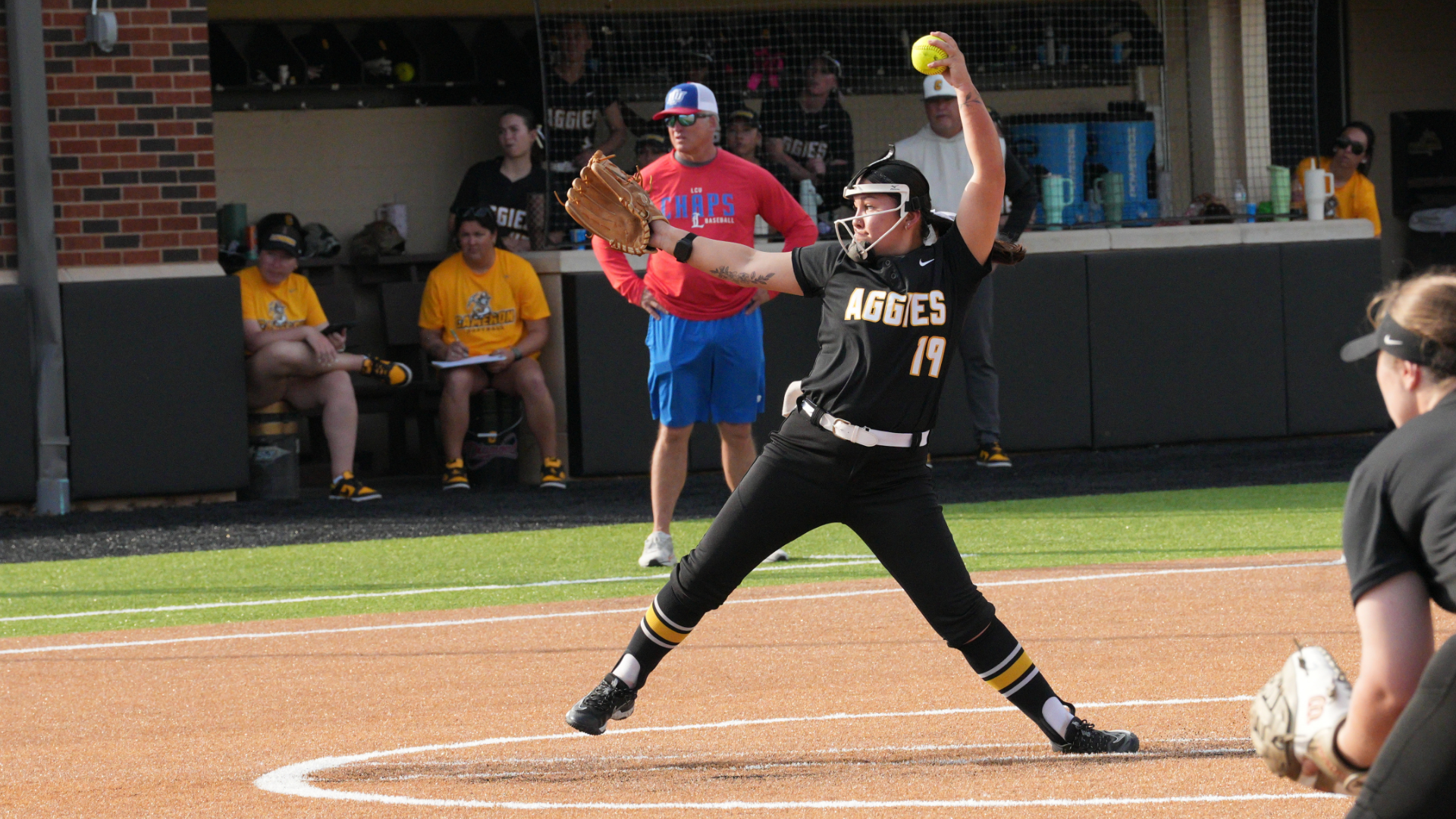 Cameron softball pitcher in the middle of throwing a pitch