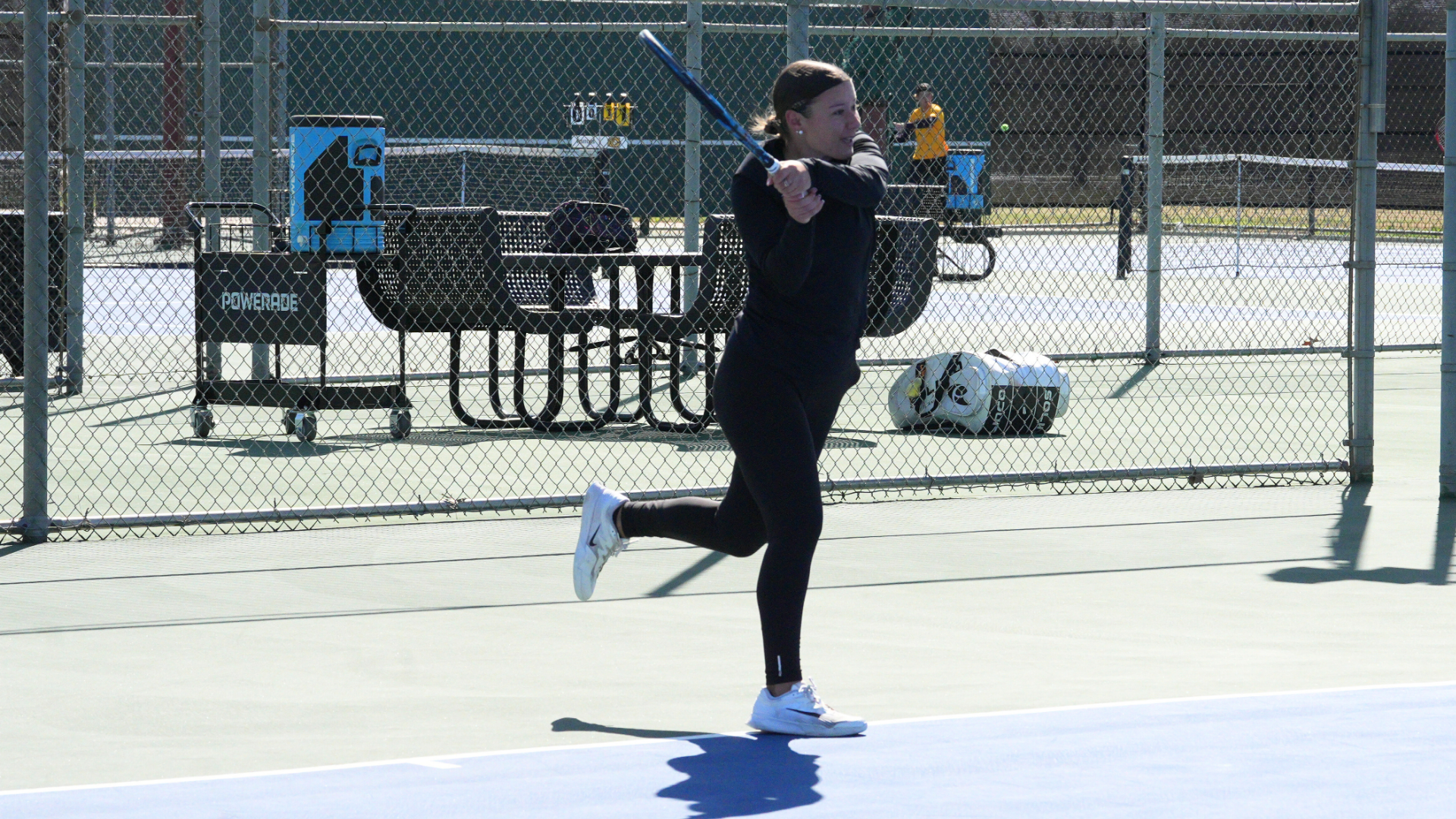 Cameron women's tennis player hitting a backhand