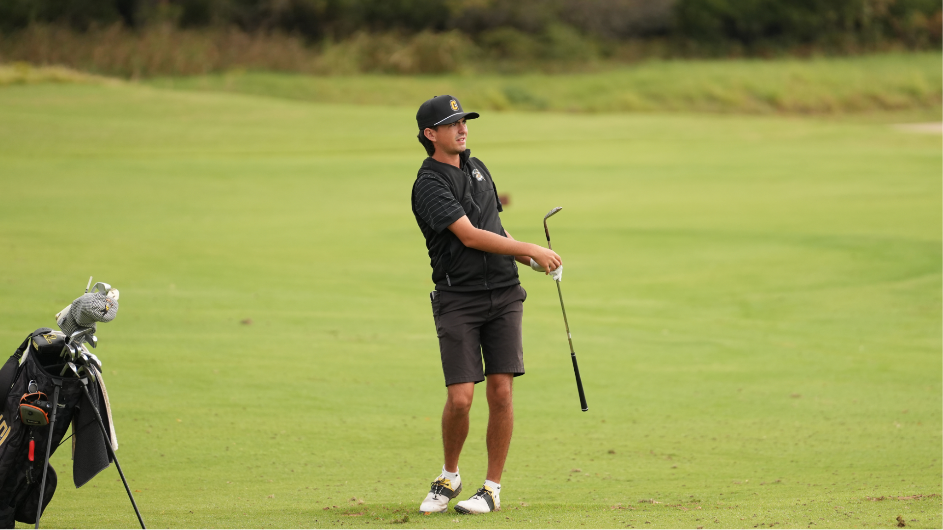Cameron Men's golfer Carson Wright after hitting a shot
