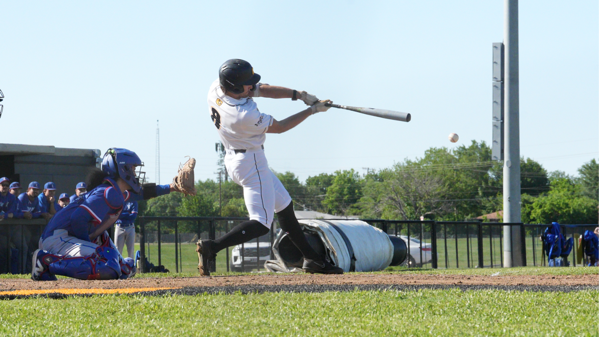 Cameron Baseball player, Zane Roos, hitting the ball