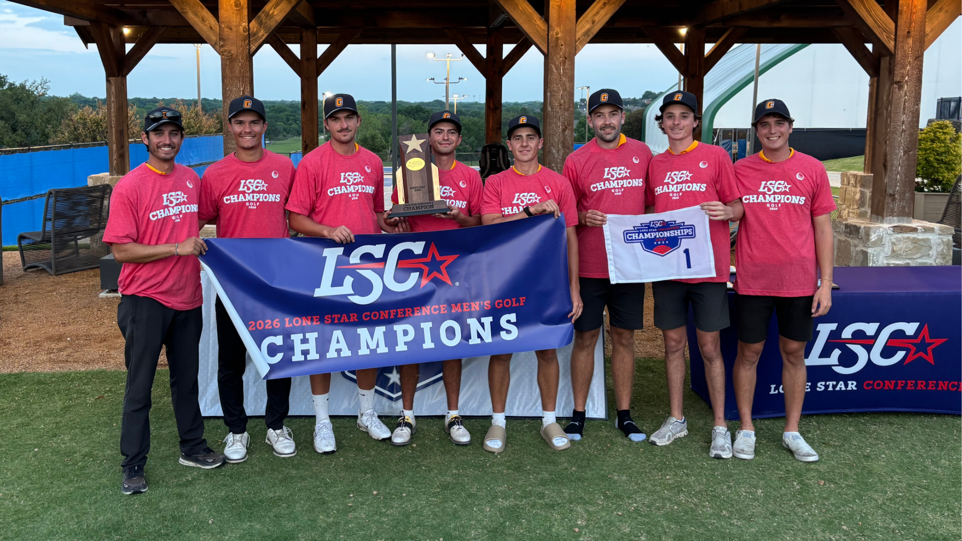 Cameron Men's golf team poses with the 2026 Lone Star Conference Men's Golf Championship banner, trophy. and towel