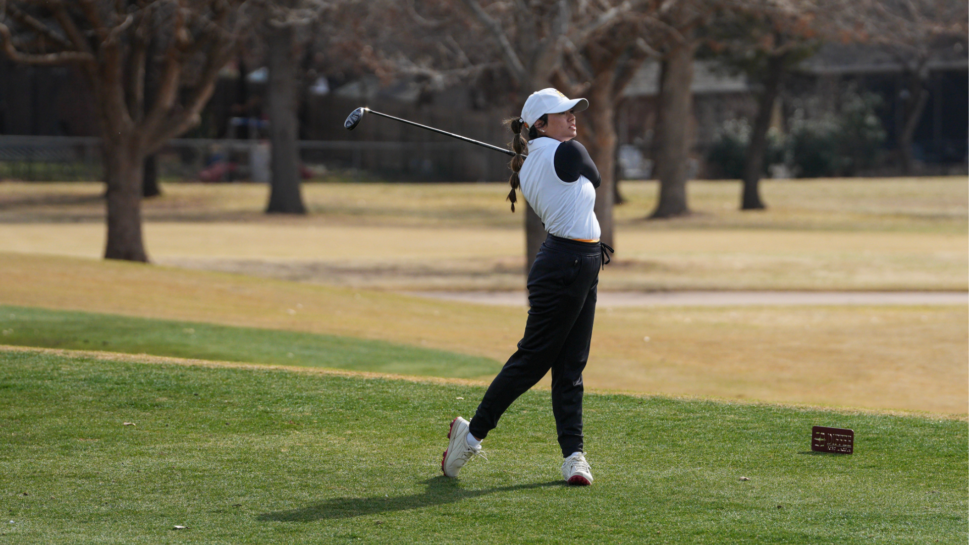 Women's golfer Jacinta Massie hits driver from tee box
