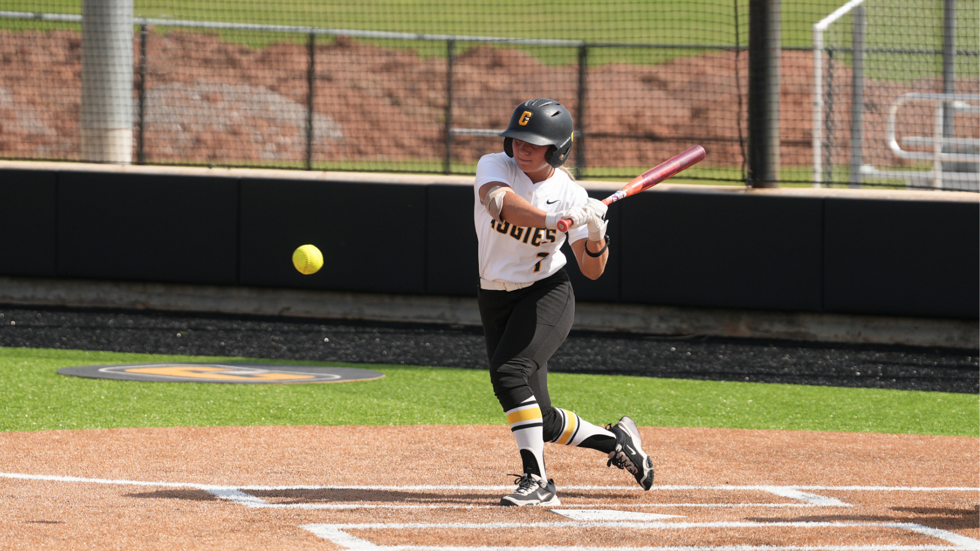 Softball player Brynn Webber goes to bunt the ball against West Texas A&M 