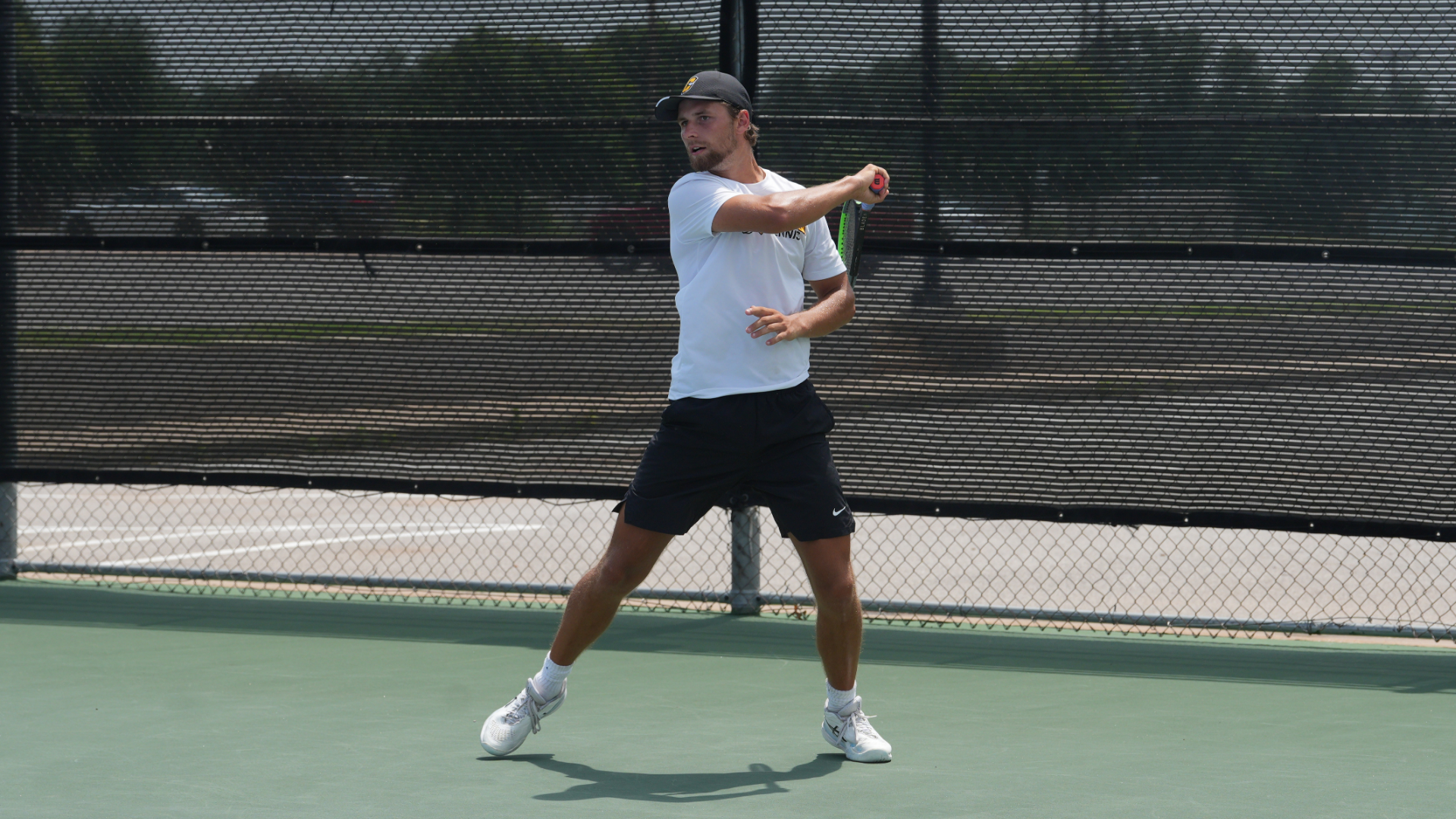 Men's tennis player, Lukas Janousek, hitting a forehand